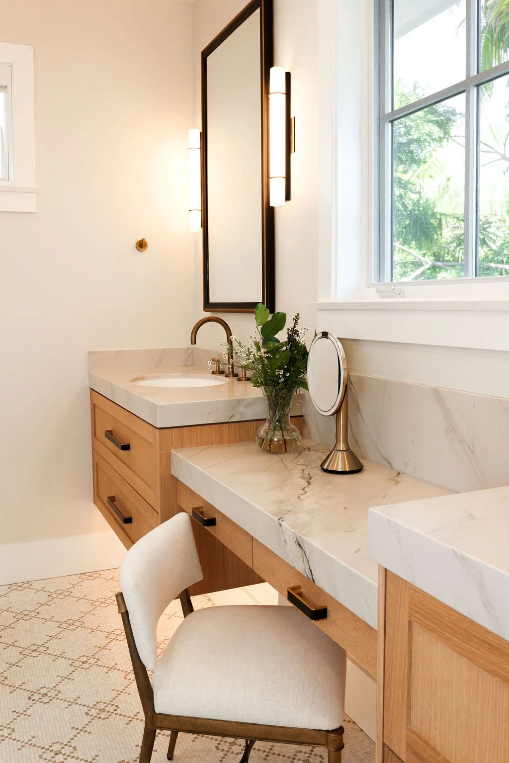 Master bath with marble flooring and quartzite countertops