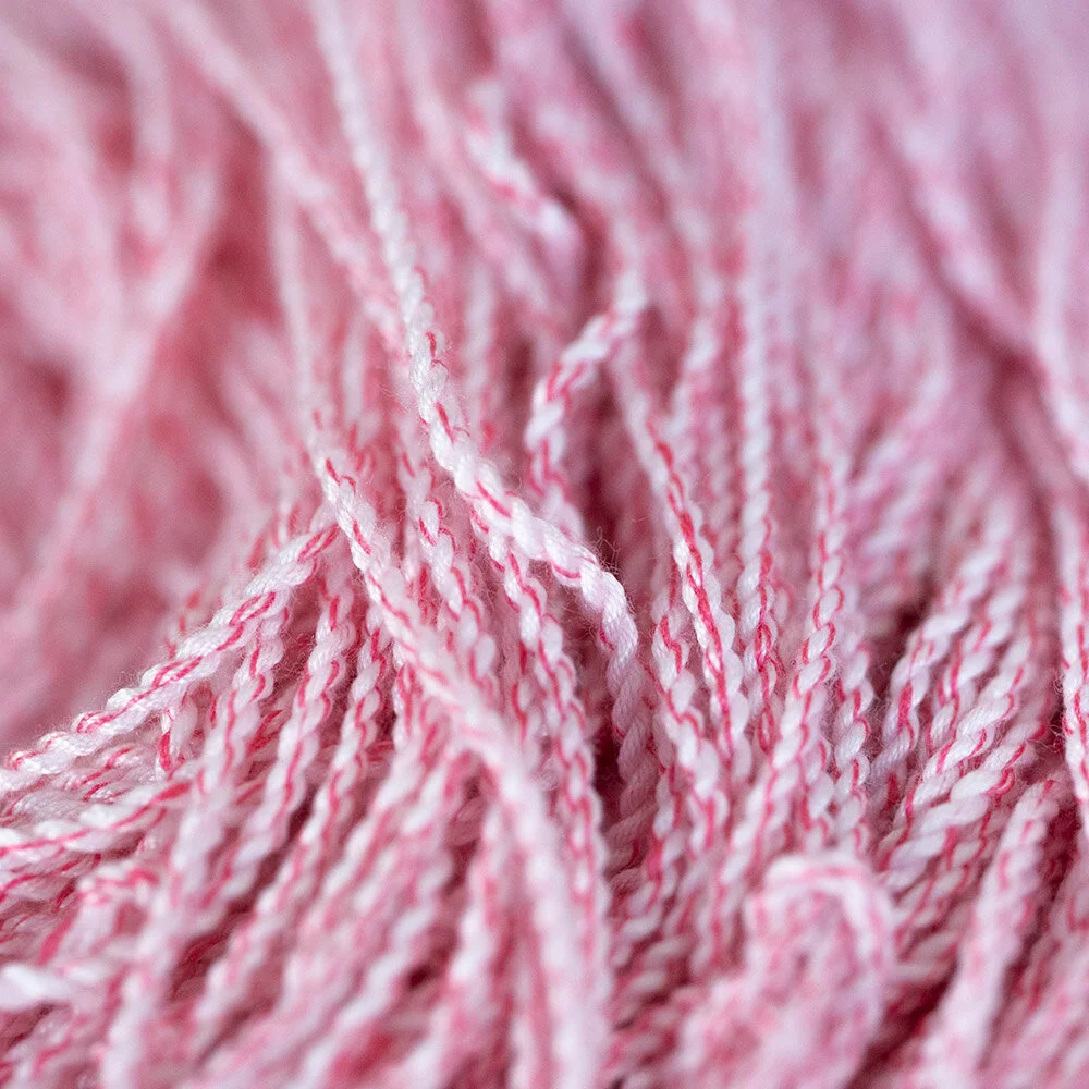 This string is bold in a playful way. Like the big kid during recess that can’t seem to play gently but has the heart of a saint 😂 This string is on the softer side but boast traits of both Rebby and DRAKEN in trace ways. Has the same tidiness in thread twist as Rebby, but with a subtle bit of ‘crisp’ felt throughout play more similar to DRAKEN (about 10% parts DRAKEN crisp per string serving 😂👌🏿) The red thread twisted throughout the string creates a nice optical pink hue that makes the string easy to see, and ‘pleasant’ lol. Something about the way this string handles tricks always gives me a strong inkling to play and explore more immediately after ever catch. Kinda like a book you just can’t stop reading. It just has a certain unique energy to it that you really wouldn’t expect from a softer more ‘wheaty’ poly blend.
