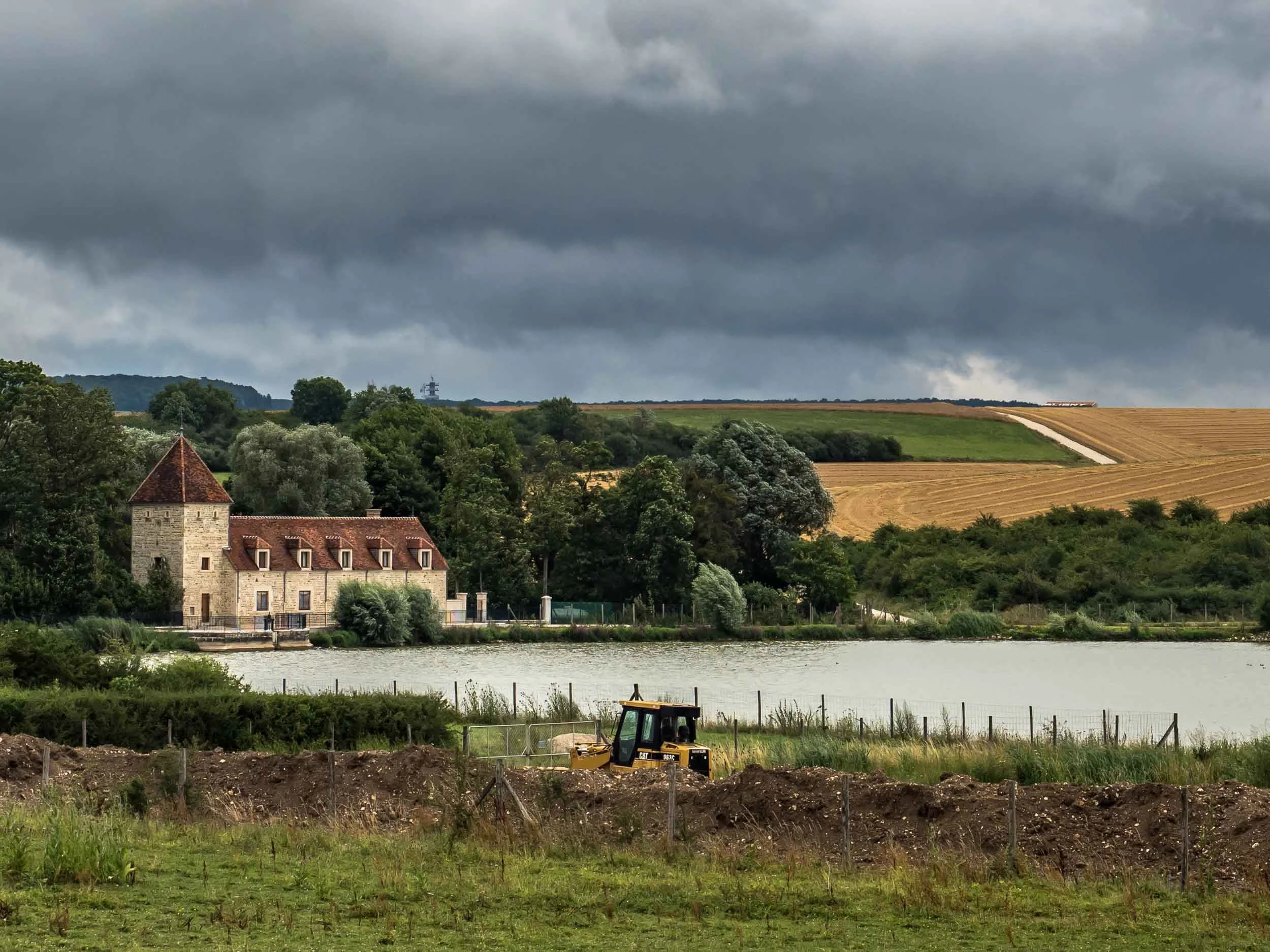 tda-cycling-paris-freiburg-dark-clouds-french-landscape.jpg