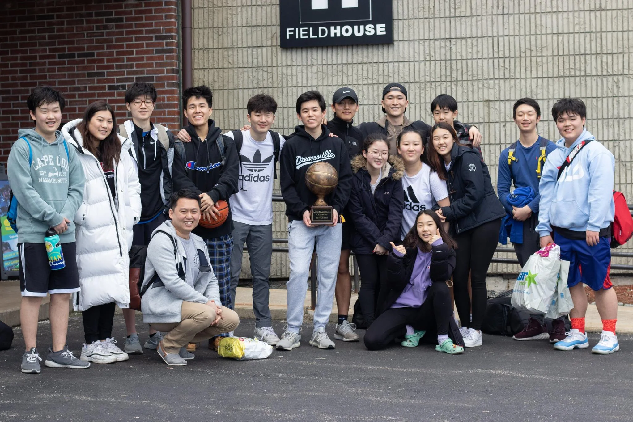 A group photo of this year’s winning team, carrying the trophy! Congratulations to KCB!