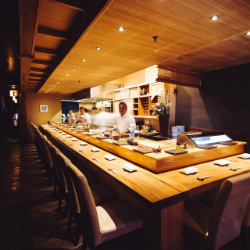KUSAKABE 「・」 This high-end sushi spot offers a light-soaked, Zen-like space for sushi, sake, wine & beer.