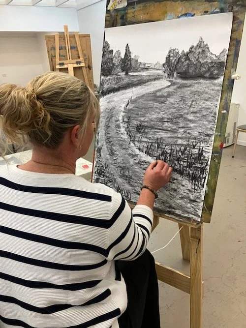 Charcoal drawing of the road approcing a farm