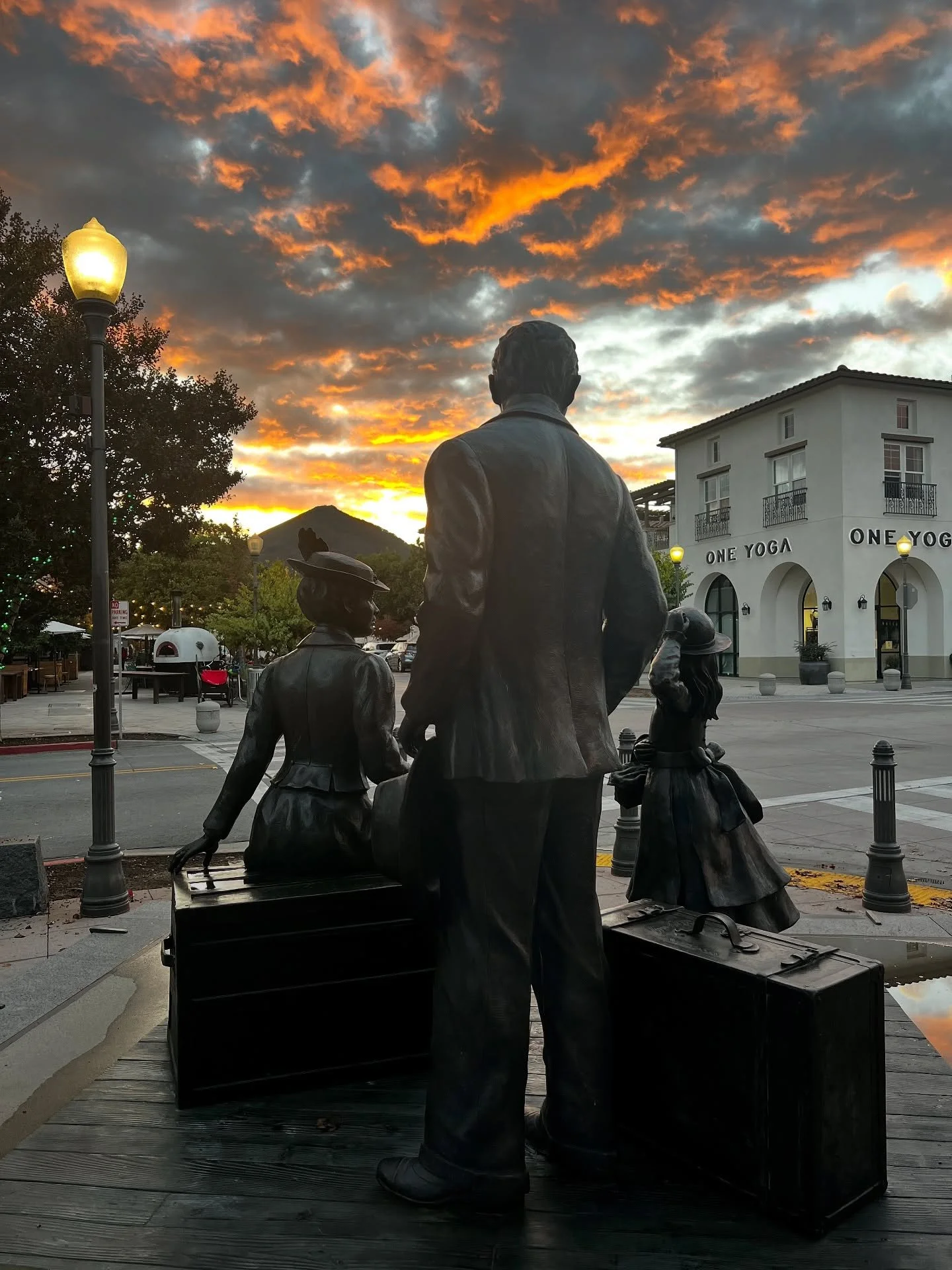 The rain let up just long enough for this downtown moment&mdash;The Hill family statue overlooking El Toro, and a sunset that stopped everyone in their tracks.

The sculpture is called Waiting for the Train, by artist Marlene Amerian. It&rsquo;s loca