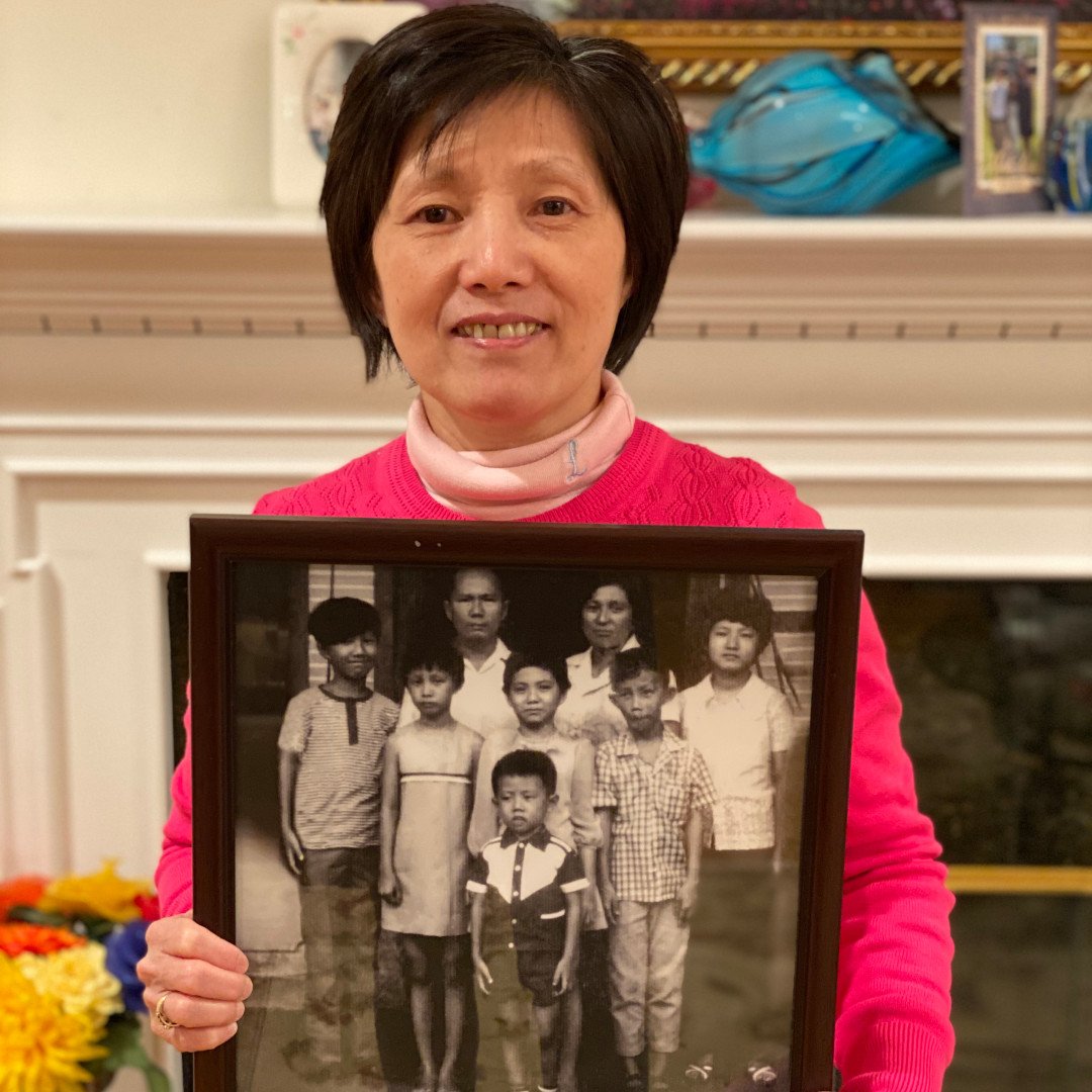 S1E2 Social 01 - Lynn Hsu holds a treasured family photo in her home in 2020 Feb - photo courtesy of Lisa Phu.jpg