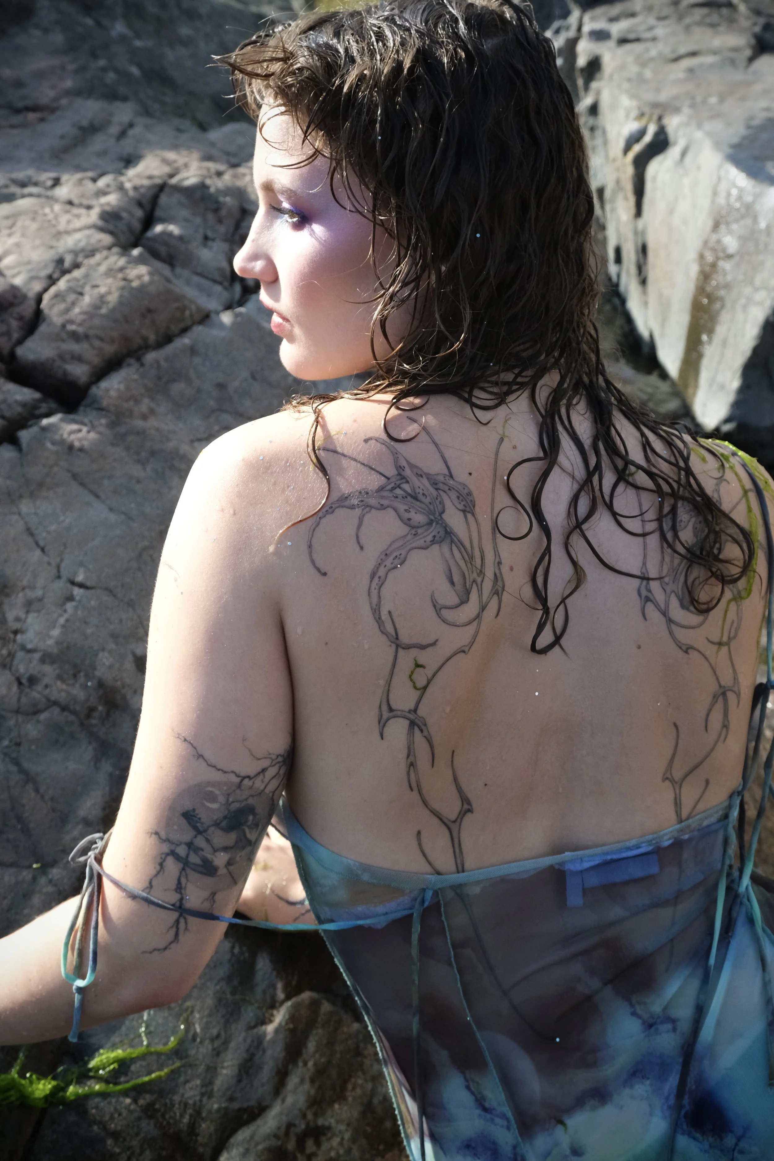 Floral finaline back tattoo Helsinki