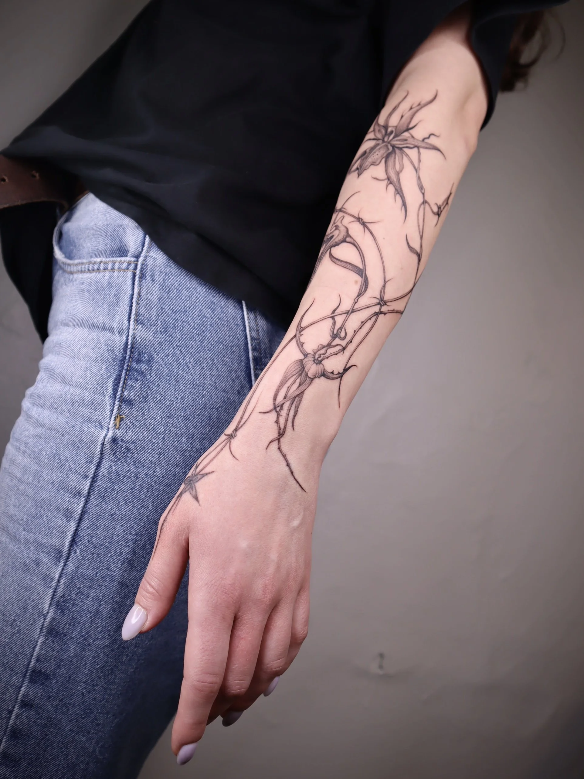 Floral fineline sleeve tattoo Helsinki