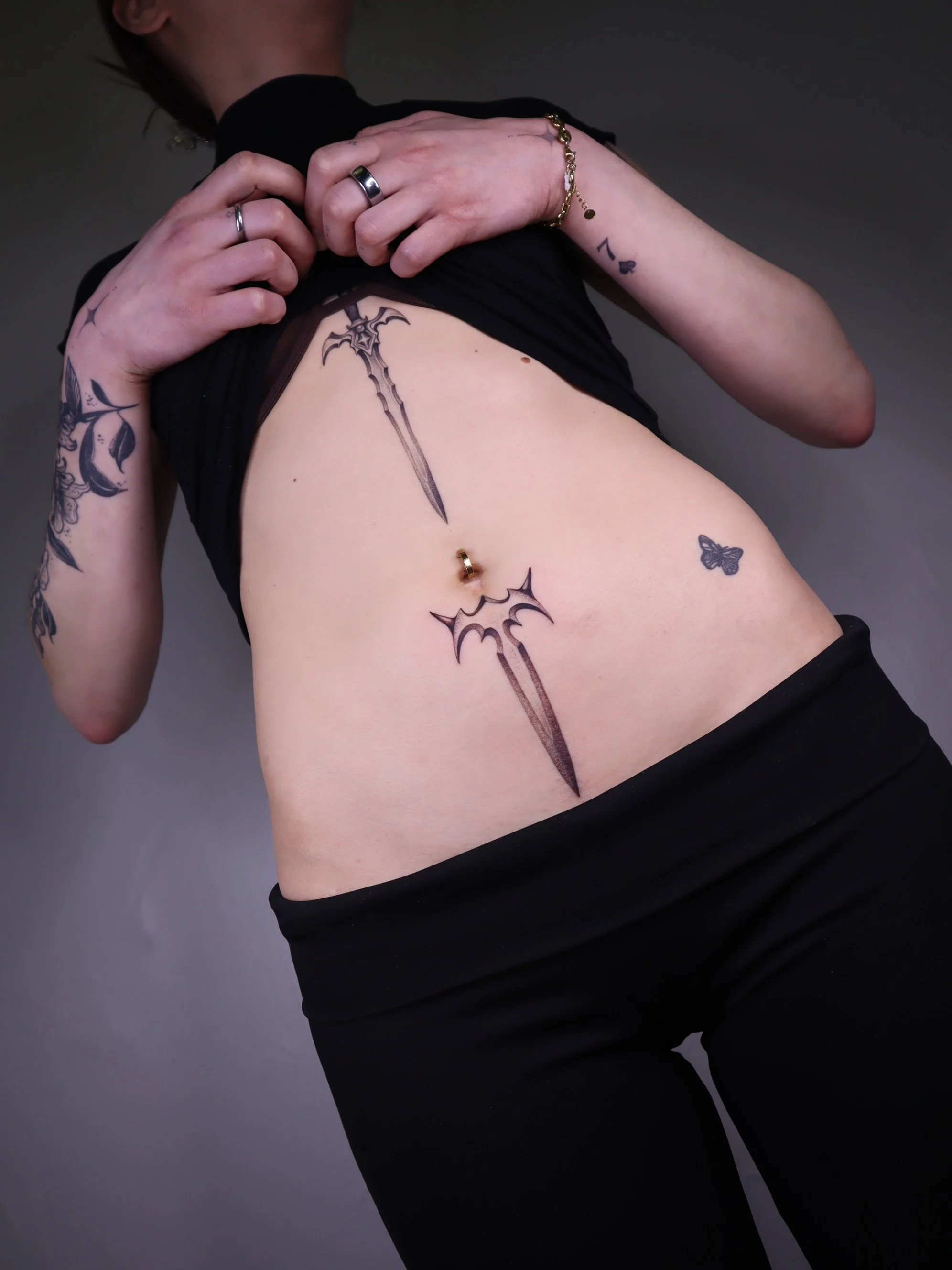 Sword and dagger fineline tattoo Helsinki