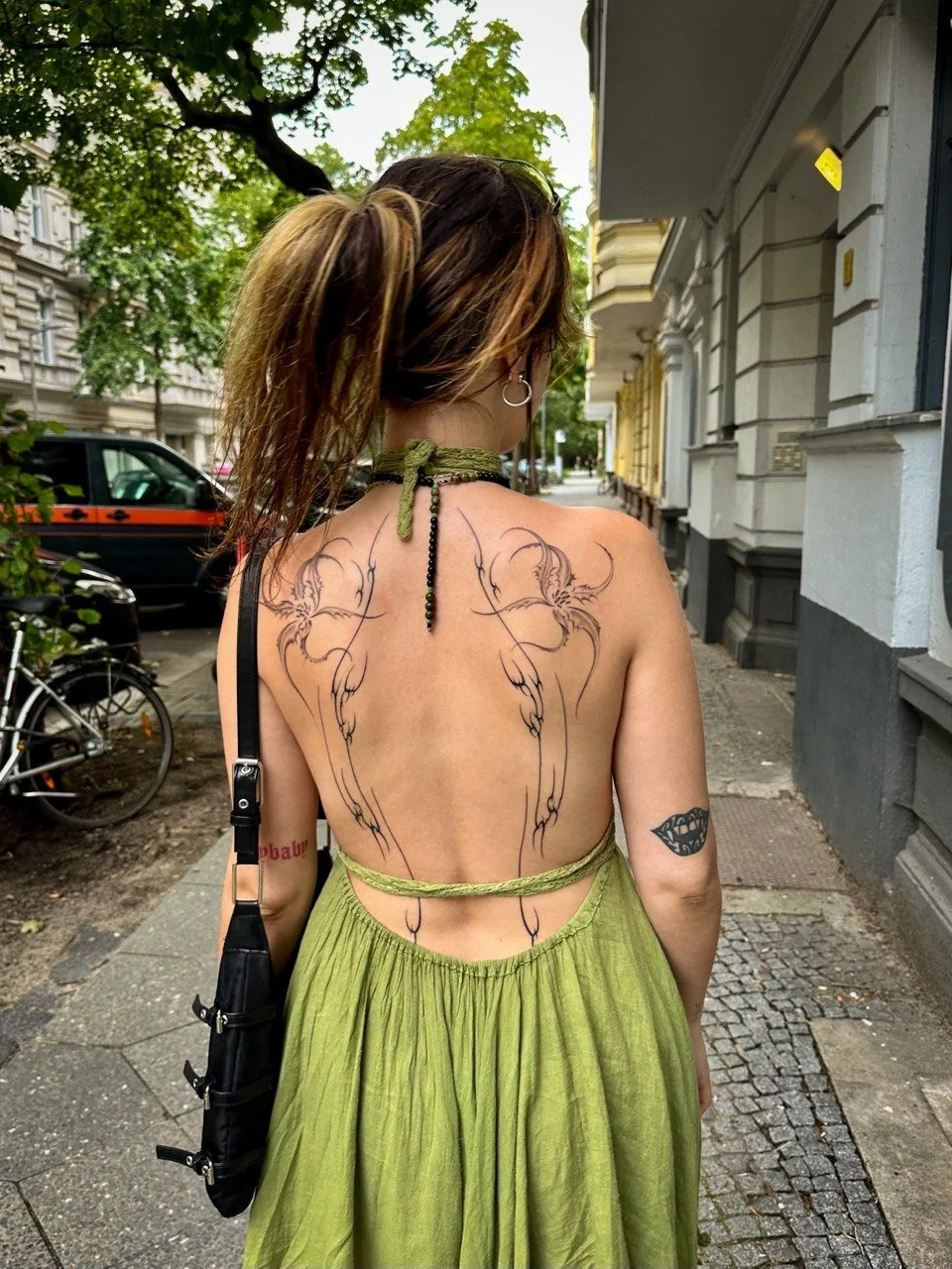 Floral finaline back tattoo Helsinki