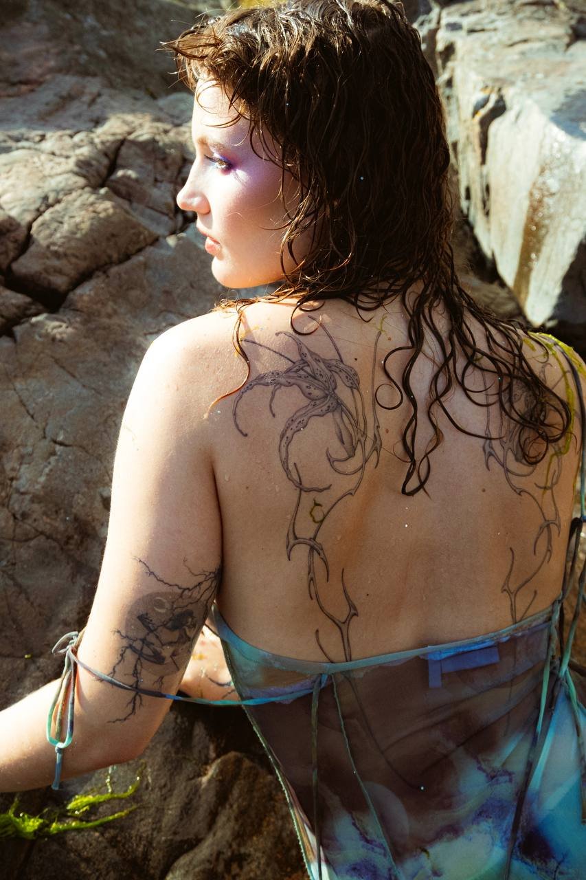 Floral finaline back tattoo Helsinki