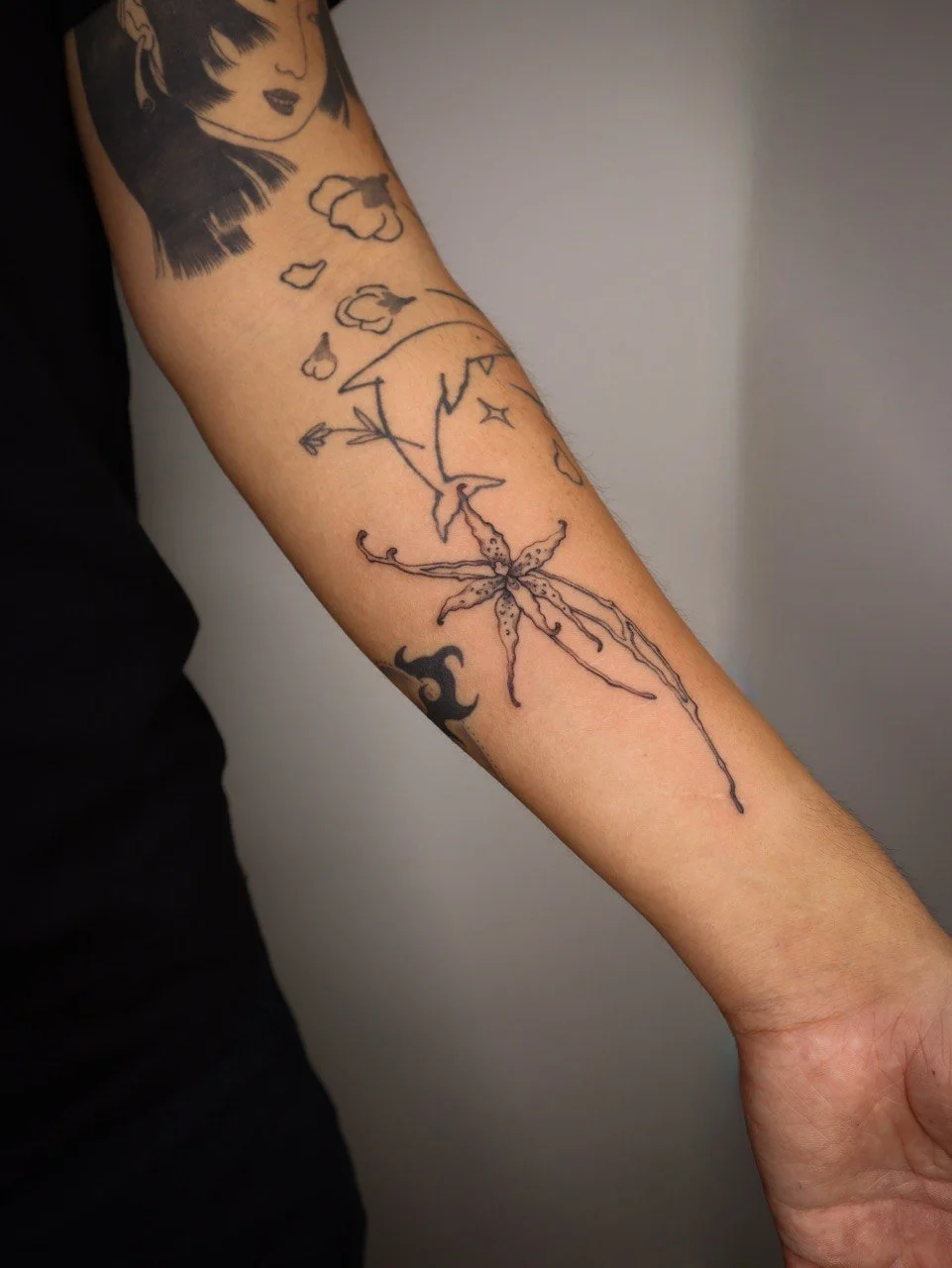 Floral finaline arm tattoo Helsinki