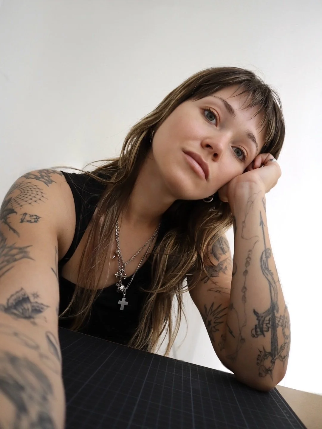 Portrait of Helsinki tattoo artist Sister Serpent specialising in fine line and neo-tribal tattoos.
