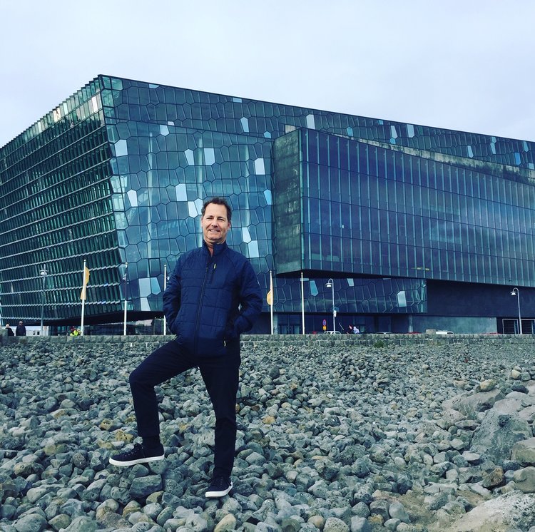 Rich Granoff in front of Harpa, a concert hall and conference center located in Reykjavik. Completed in 2011, the centralized layout with perimeter circulation allows natural daylight to flood the interior. Image courtesy of Rich Granoff