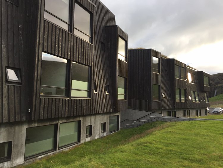 Simple structural design maximizes durability while large window panels highlight views and maximize natural light within the interior of this hotel in northern Iceland. Image courtesy of Rich Granoff