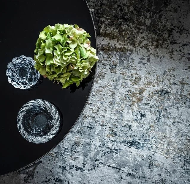 The textural and colour palette of a recently completed project. A richly patterned rug was selected to create contrast and movement against the stark black glass coffee table. And adding the client&rsquo;s vintage glass ornaments from a holiday in B