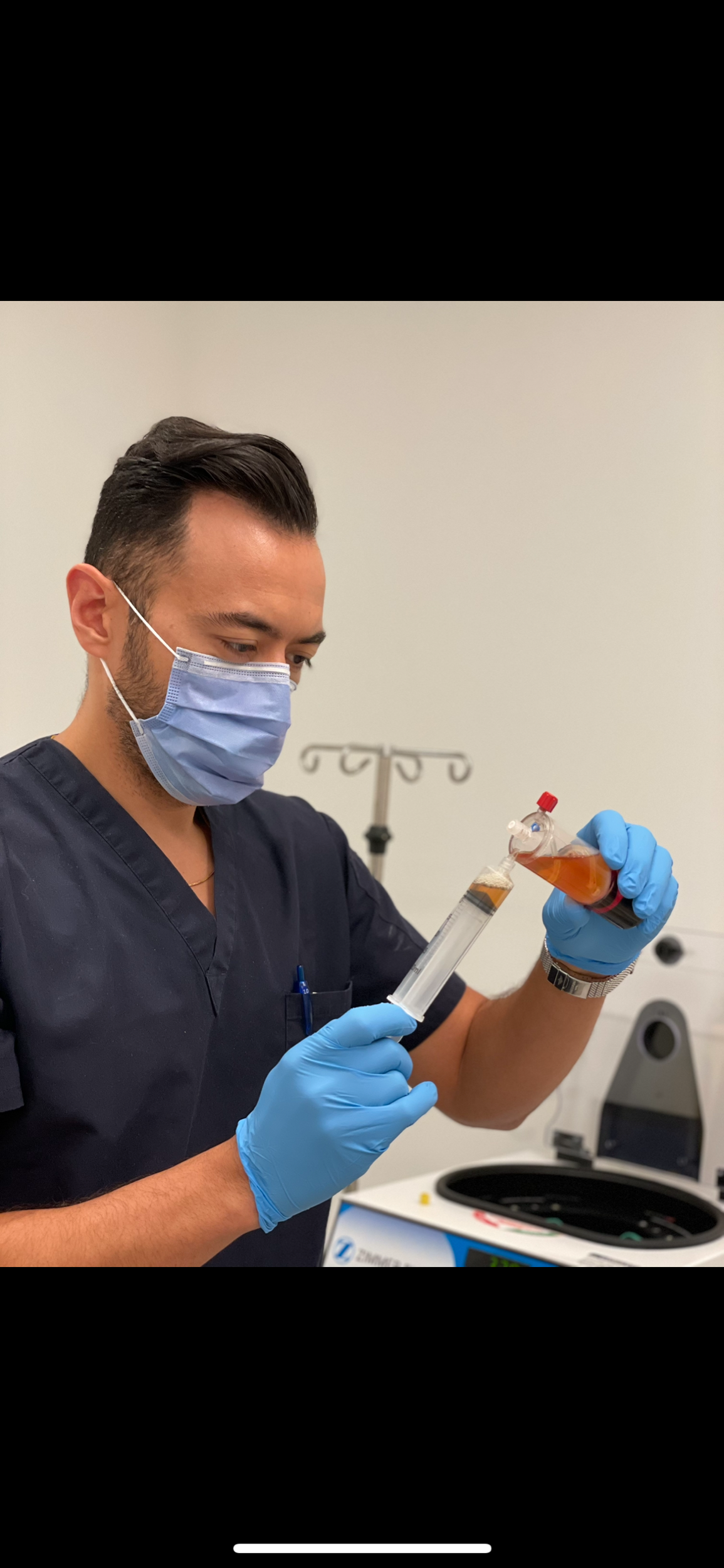 Dr. Abouali preparing a PRP injection