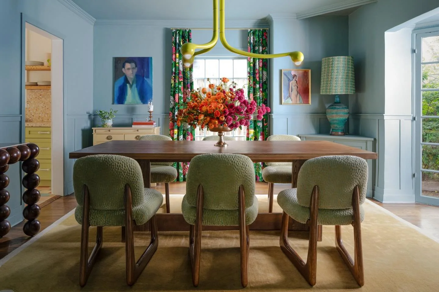 We went through several iterations of this dining space. Ultimately, we collectively landed on letting color take the stage the way it was meant to. A soft but uplifting blue with touches of chartreuse, emerald, ochre and rich woods. 

P.S. Don&rsquo