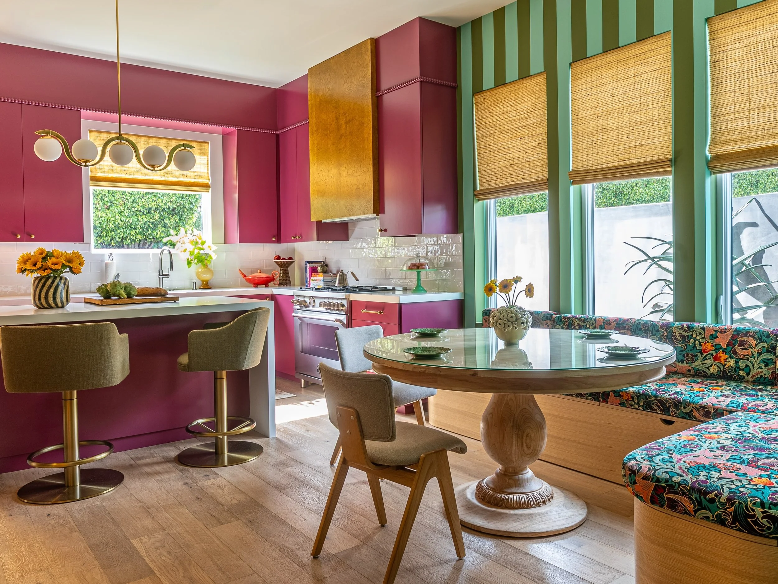 I will never understand the appeal of a bland, builder grade home. The good news, we can help fix that. Here to show what color and pattern does for a space! Apart from the beautiful custom storage dining banquette &amp; range hood clad in mappa burl