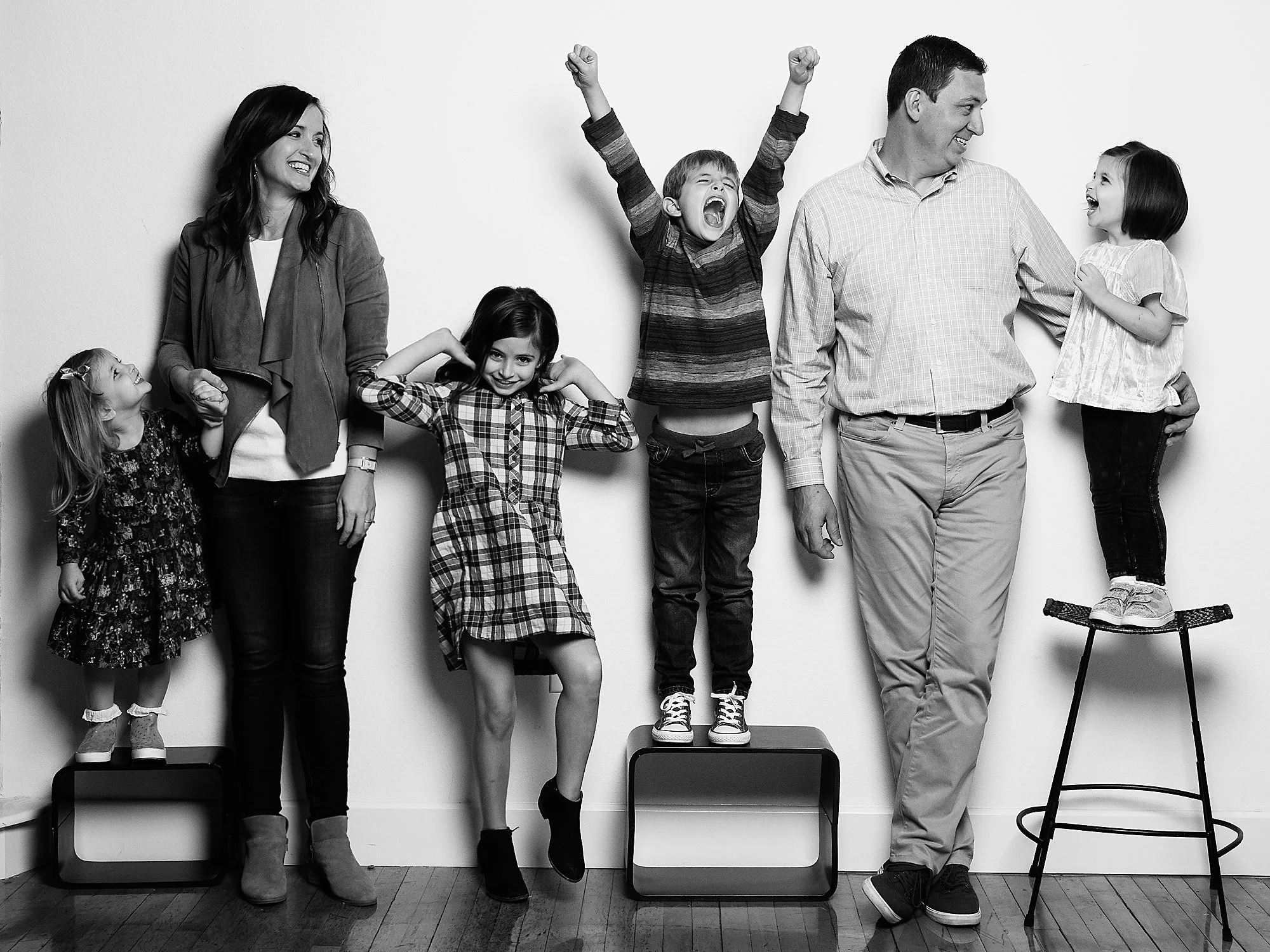 Black and white photograph taken in studio of a family in Dallas