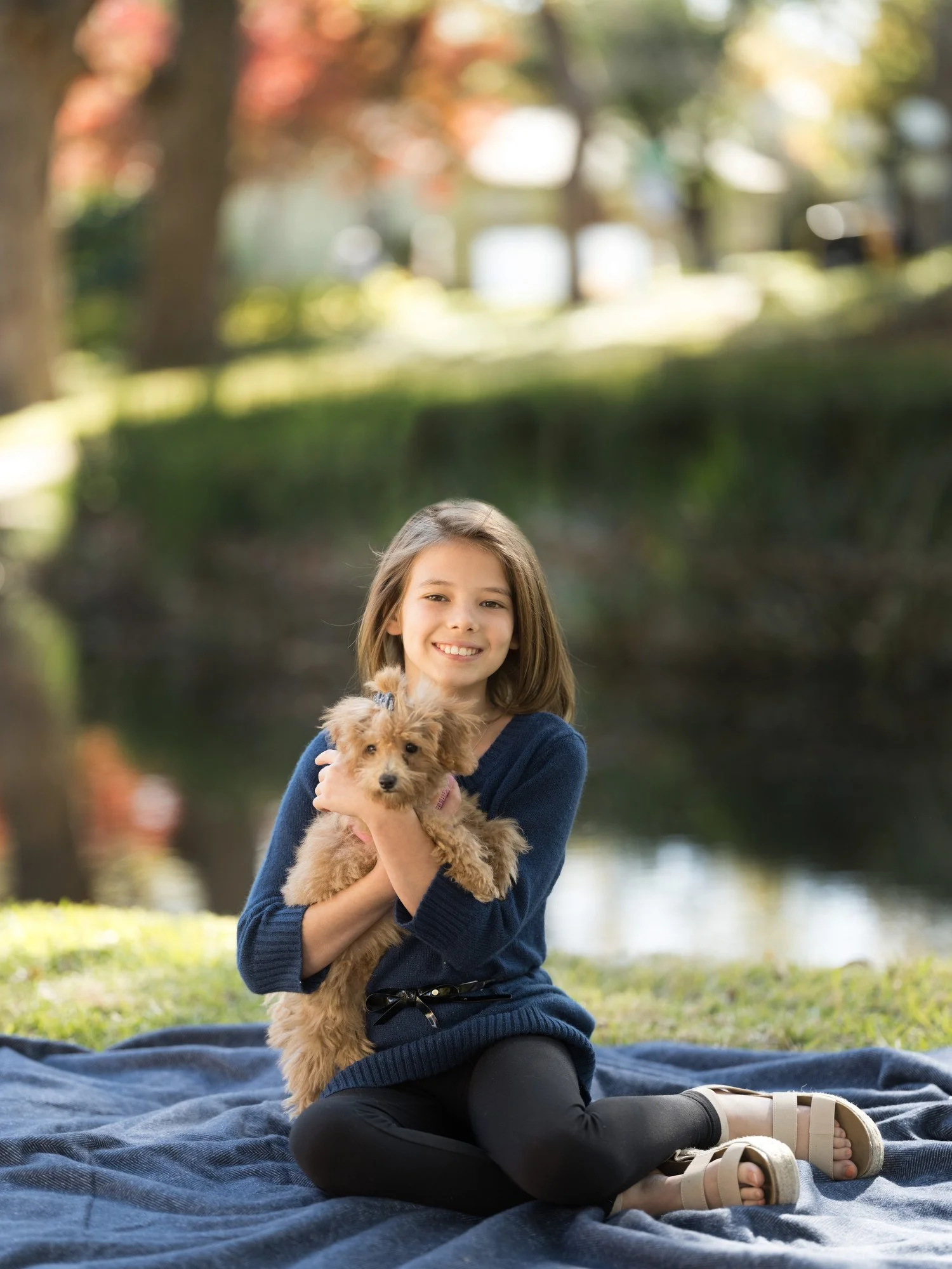 Portrait of a girl and her puppy near White Rock Lake