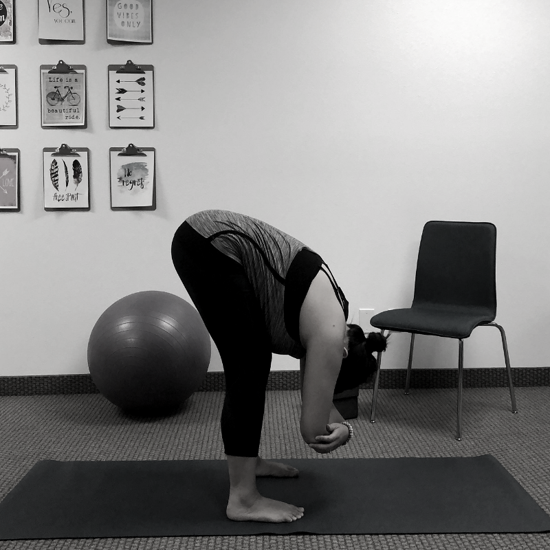 Yoga Pose Library - Standing Forward Fold (Uttanasana) - Ellie Stafford Yoga