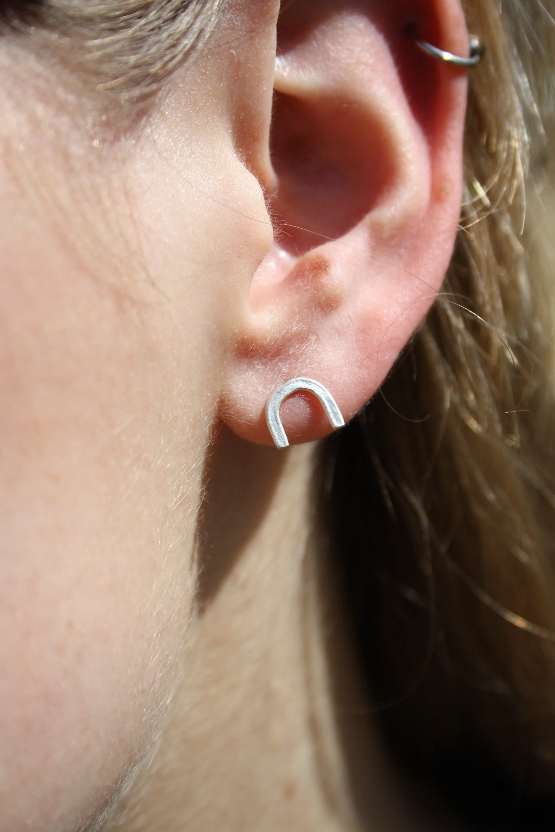 Silver U-shaped studs