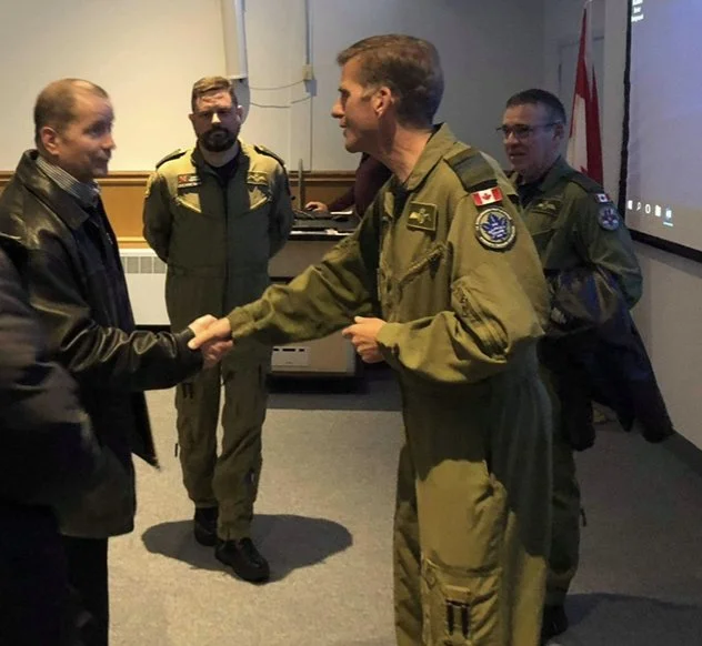 Shawn meeting with a group of Air Force Members