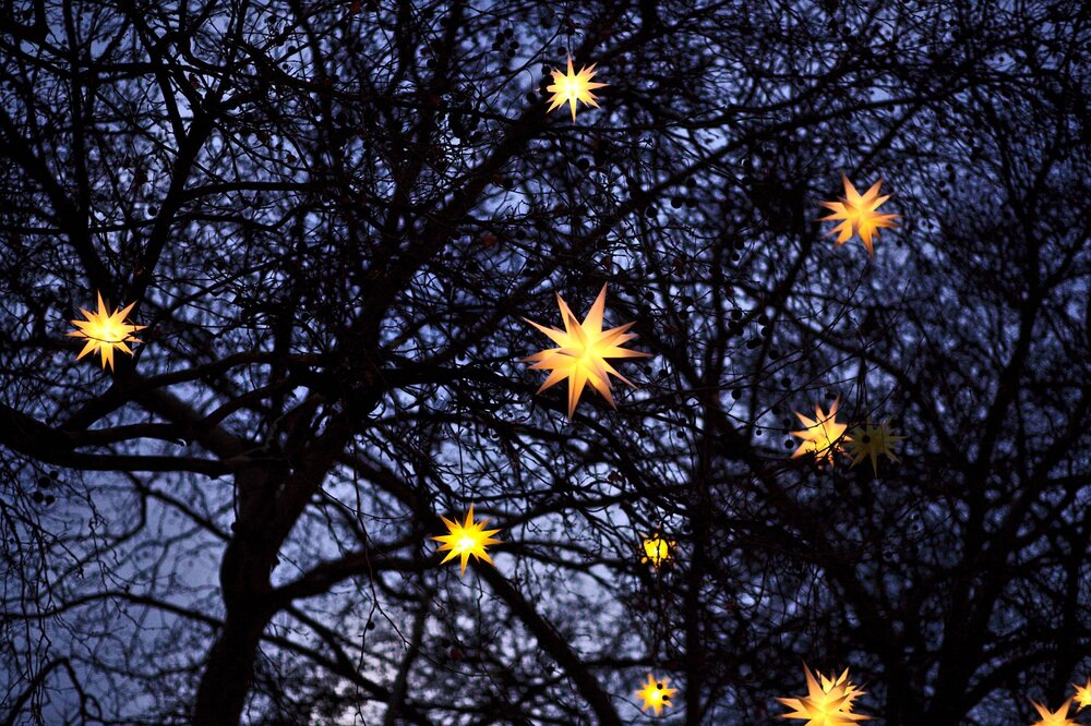 Bethlehem star ornaments in night sky