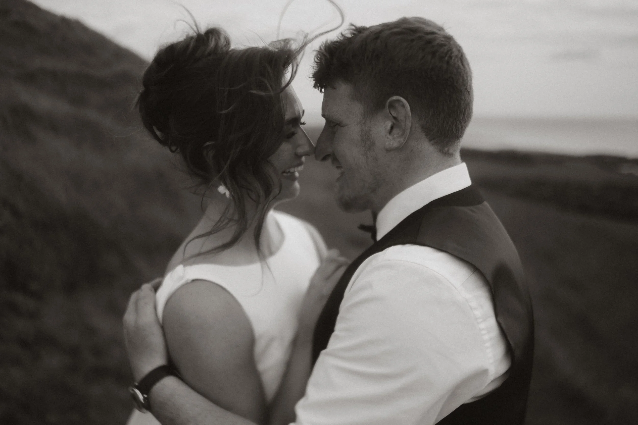 Beautiful and emotive black and white wedding photograph of bride and groom in the lake district national park