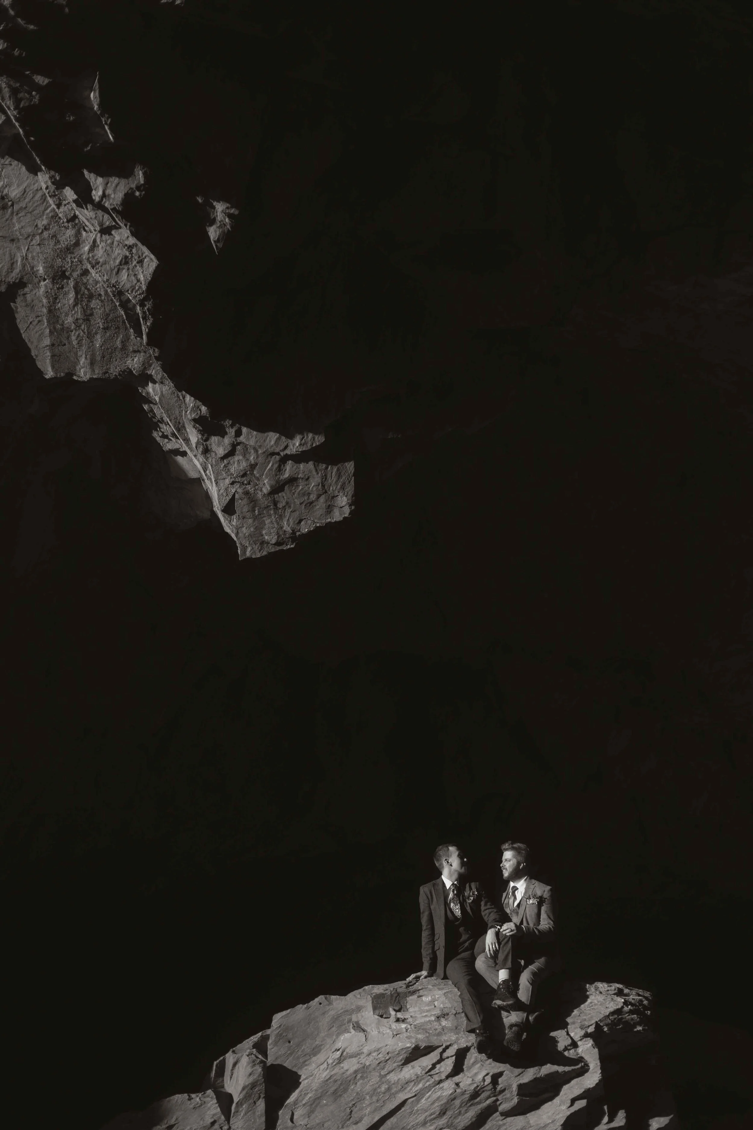 couple visit moody cave on wedding day to capture artistic creative wedding images non traditional photographer modern style