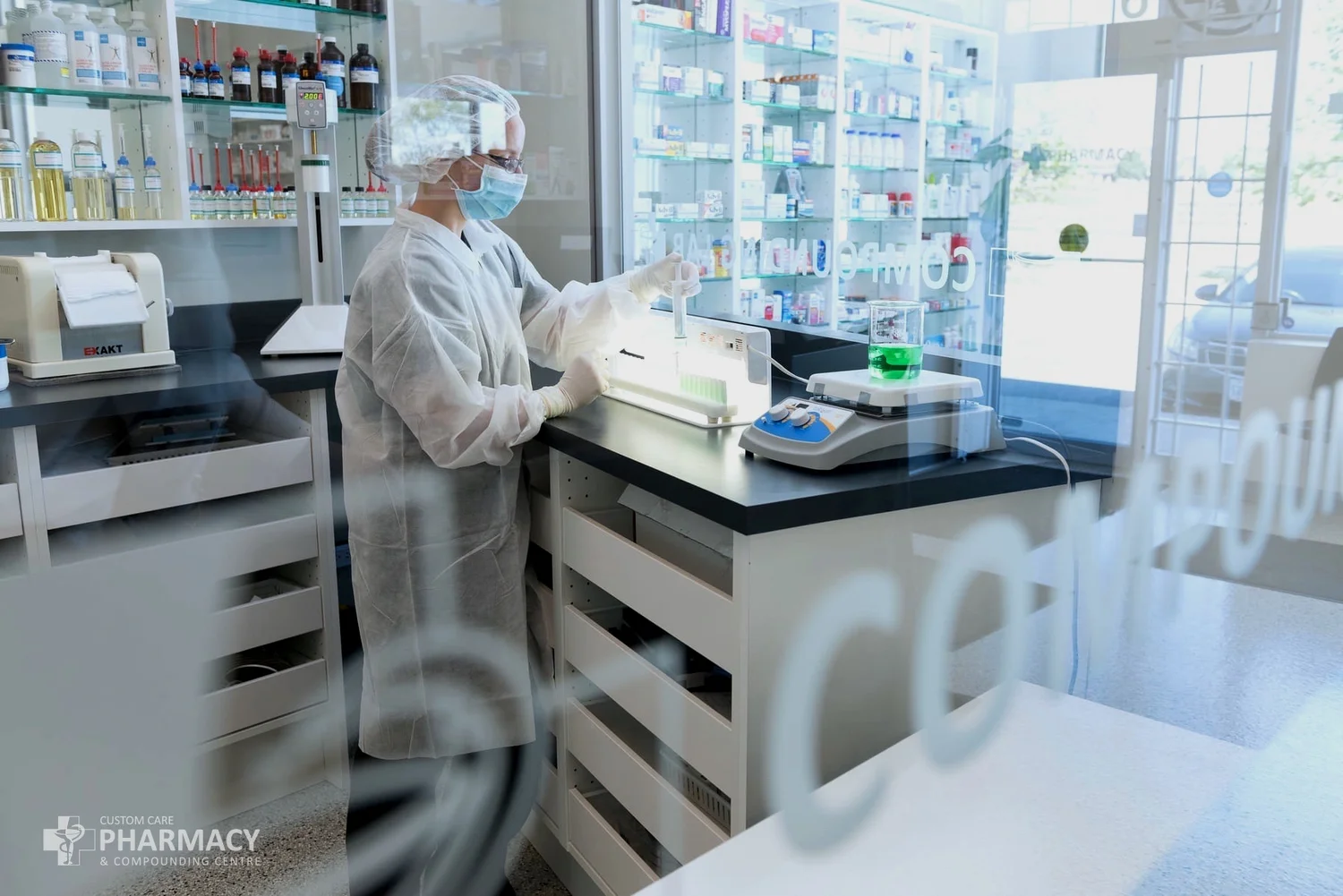 Medication preparation in the Custom Care Pharmacy compounding laboratory.