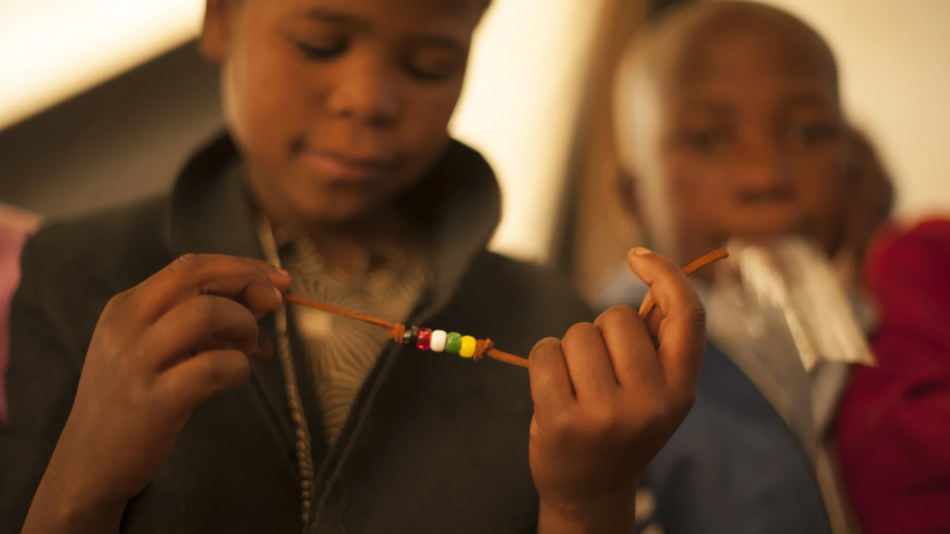 Basotho children learn to make bracelets during Vacation Bible School in the mountains of Lesotho. Photo courtesy of the International Mission Board.