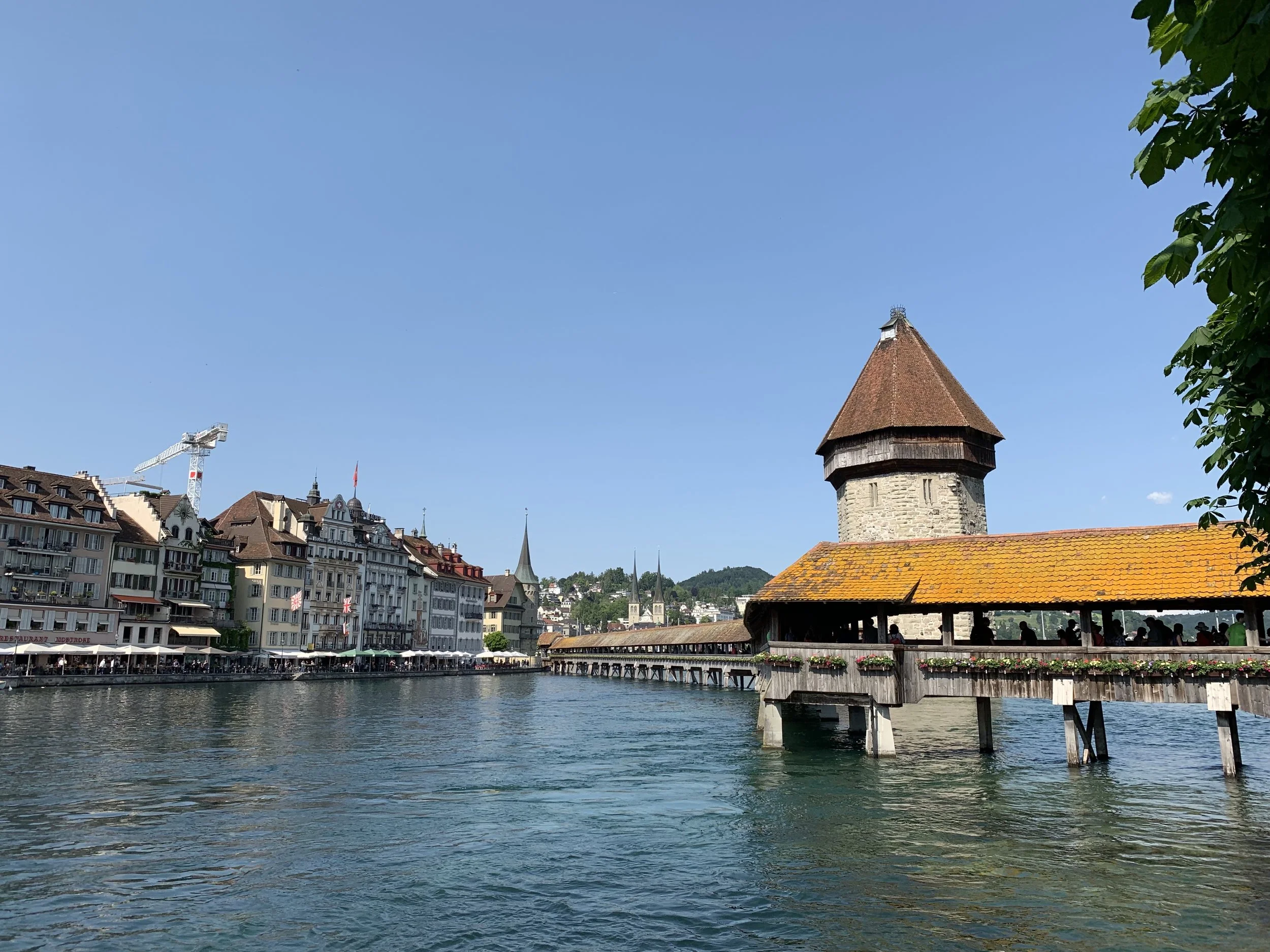 A view of old town Lucerne and the Kapellbrücke from a Reuss River bank. June 4, 2019.