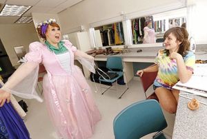 Costume Designer, Meagan Ferguson, and her apprentice, Reid Patten, work on a costume design.