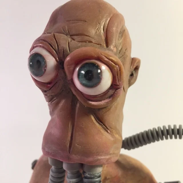  Cast resin body, super sculpt head, plastic eyes from Amazon. Legos, acrrylic paint. 