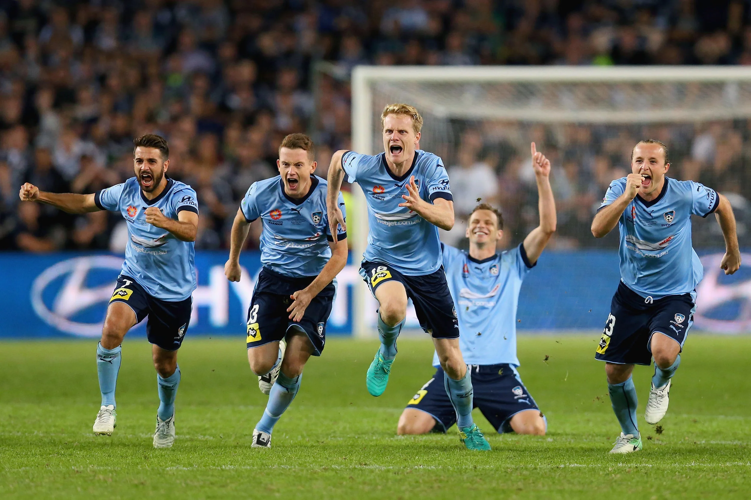 Michael Zullo, Brandon O'Neill, Matt Simon, Rhyan Grant of Sydney celebrate winning the 2017 A-League Grand Final match between Sydney FC and the Melbourne Victory at Allianz Stadium on May 7, 2017 in Sydney, Australia. (Photo by Jason McCawley/Getty Images)