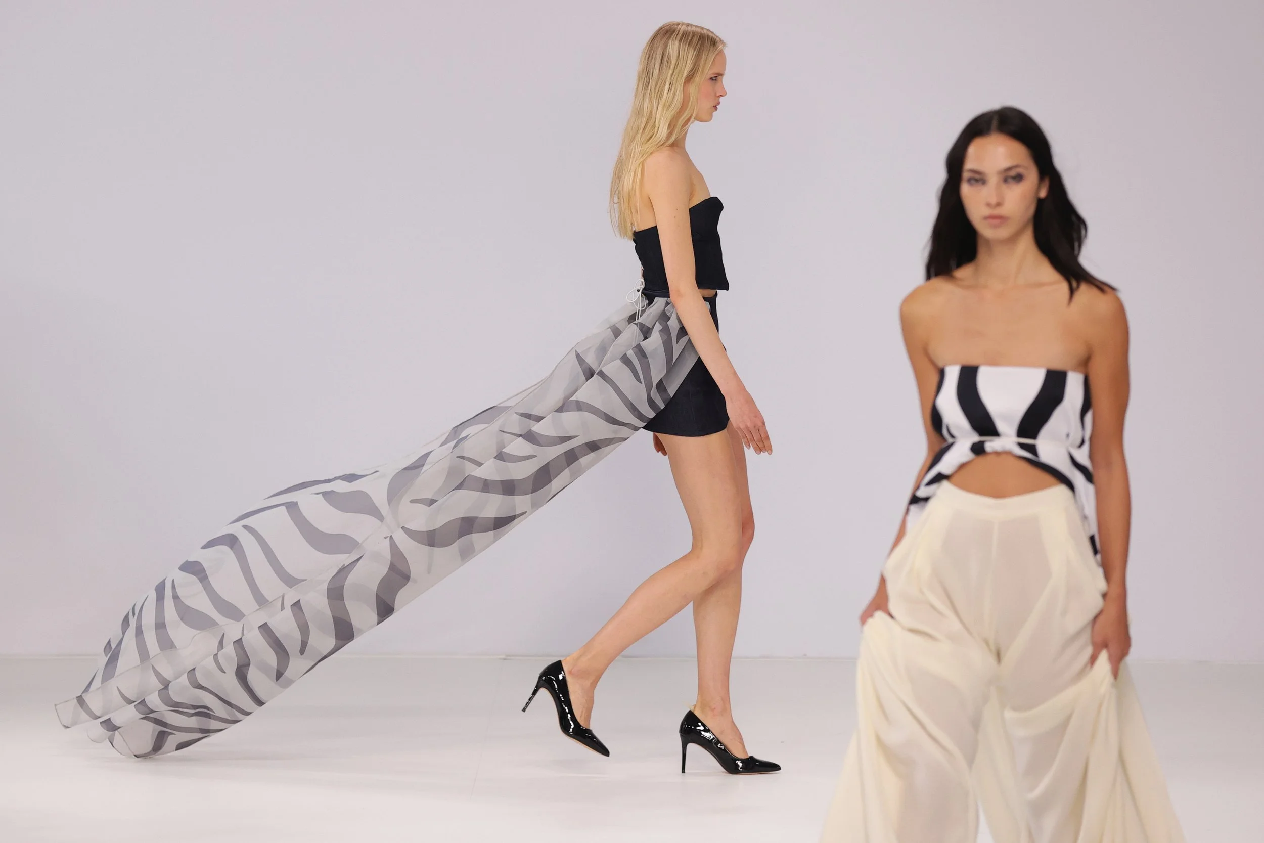  A model walks the runway wearing a design by GLORIA CHOI during the New Generation Showcase show at Australian Fashion Week 2026 at Museum of Contemporary Art on May 14, 2026 in Sydney, Australia. (Photo by Jason McCawley/Getty Images) 