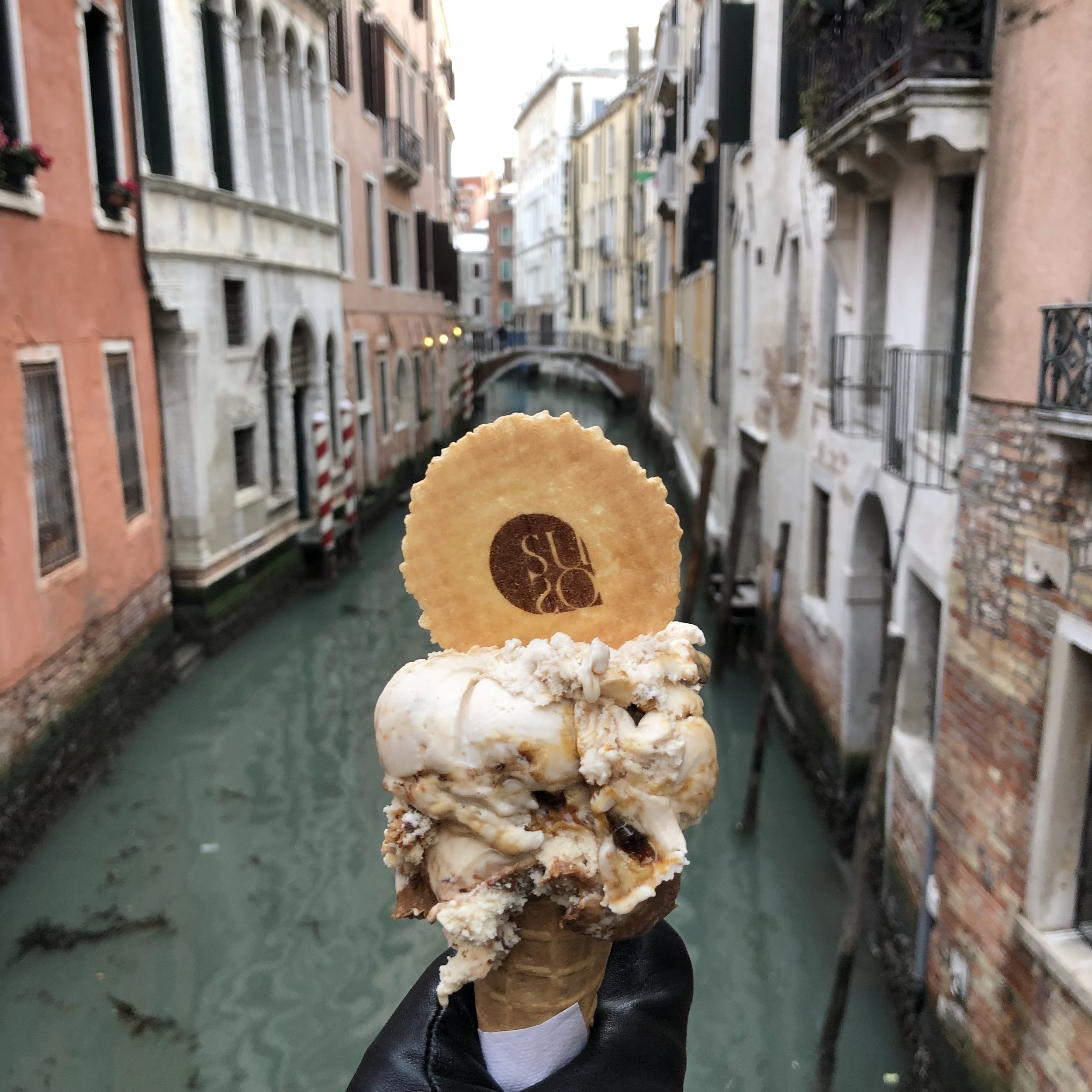 Gelato in Venice, Italy. Canals in the background