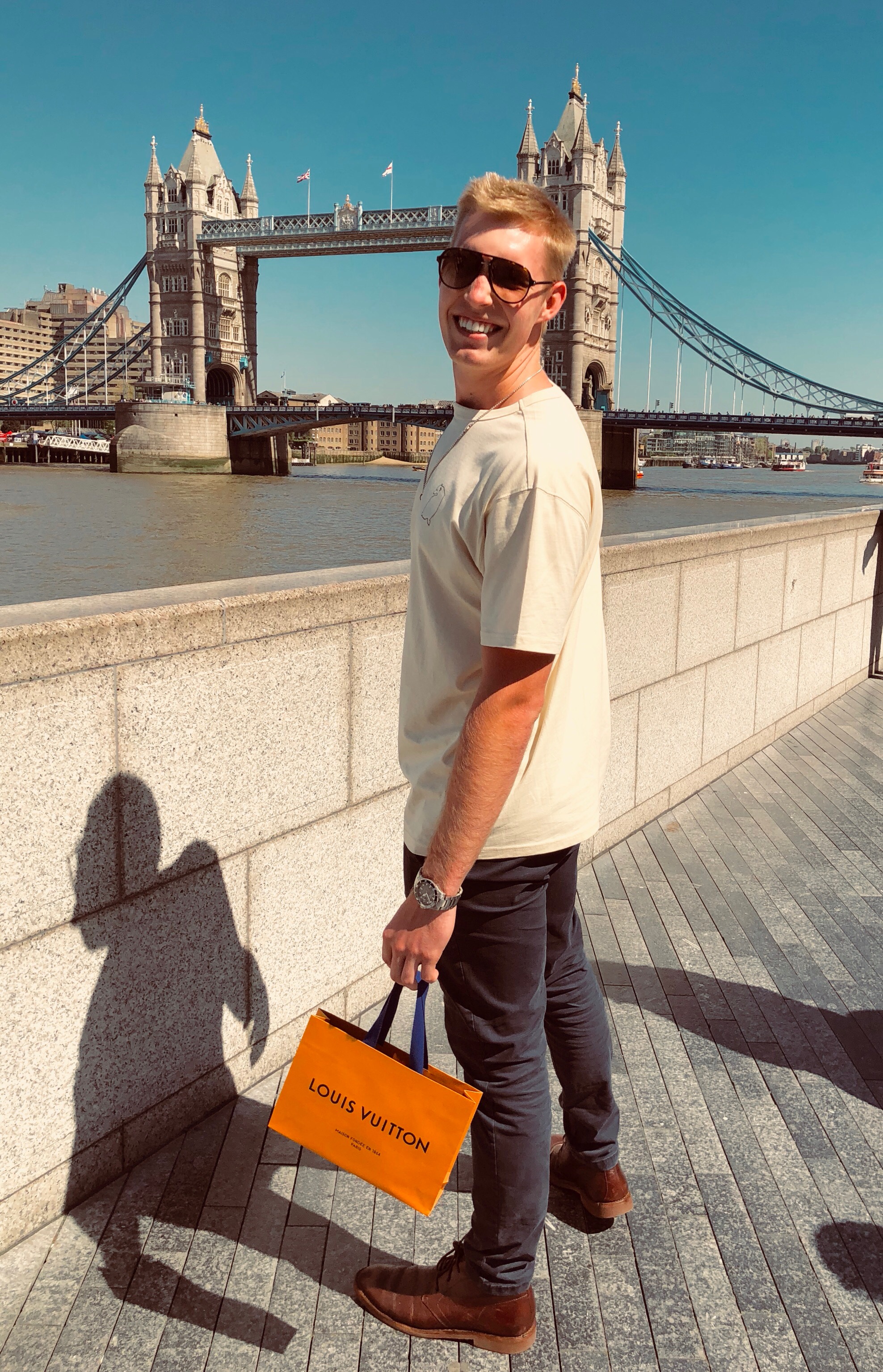 Adam in front of Tower Bridge in London, England