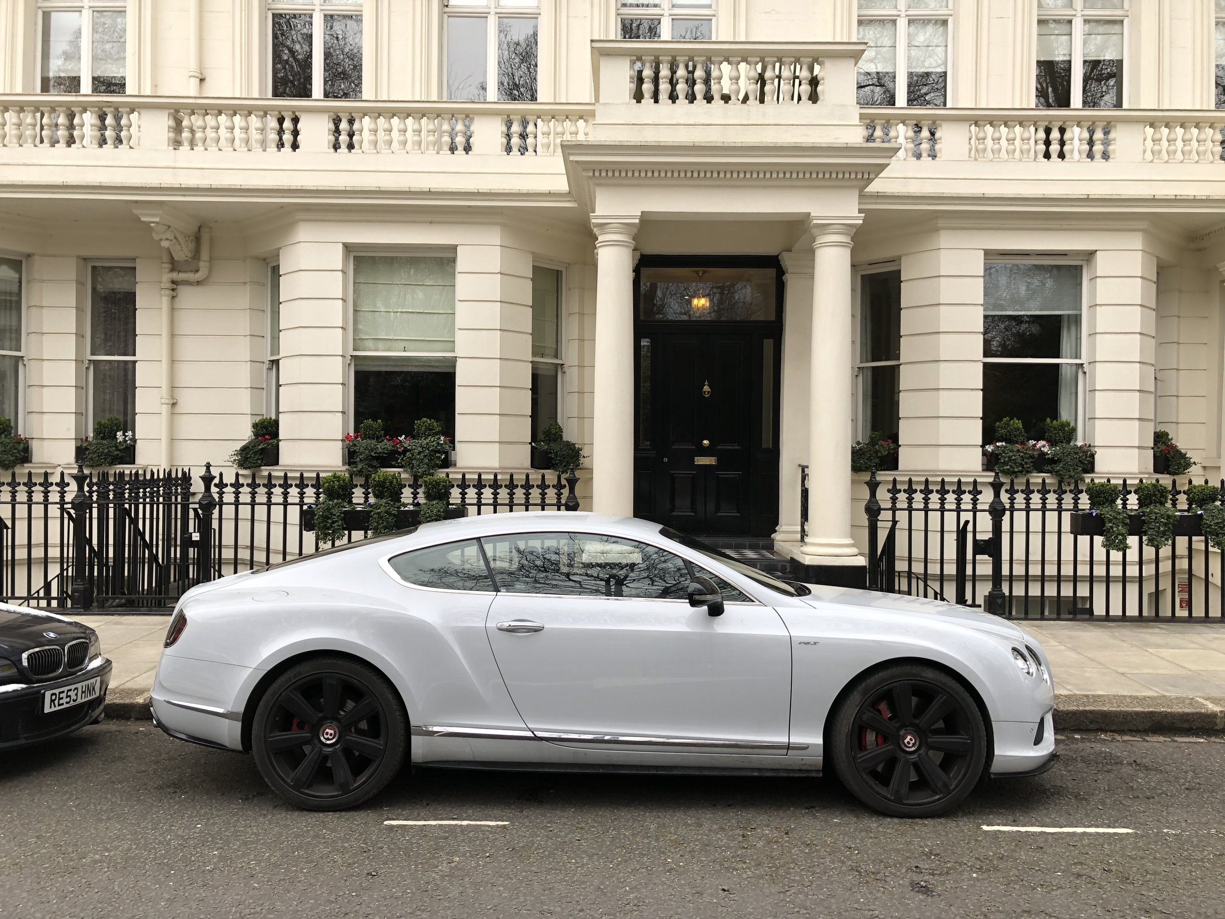Bentley in front of a townhouse in South Kensington