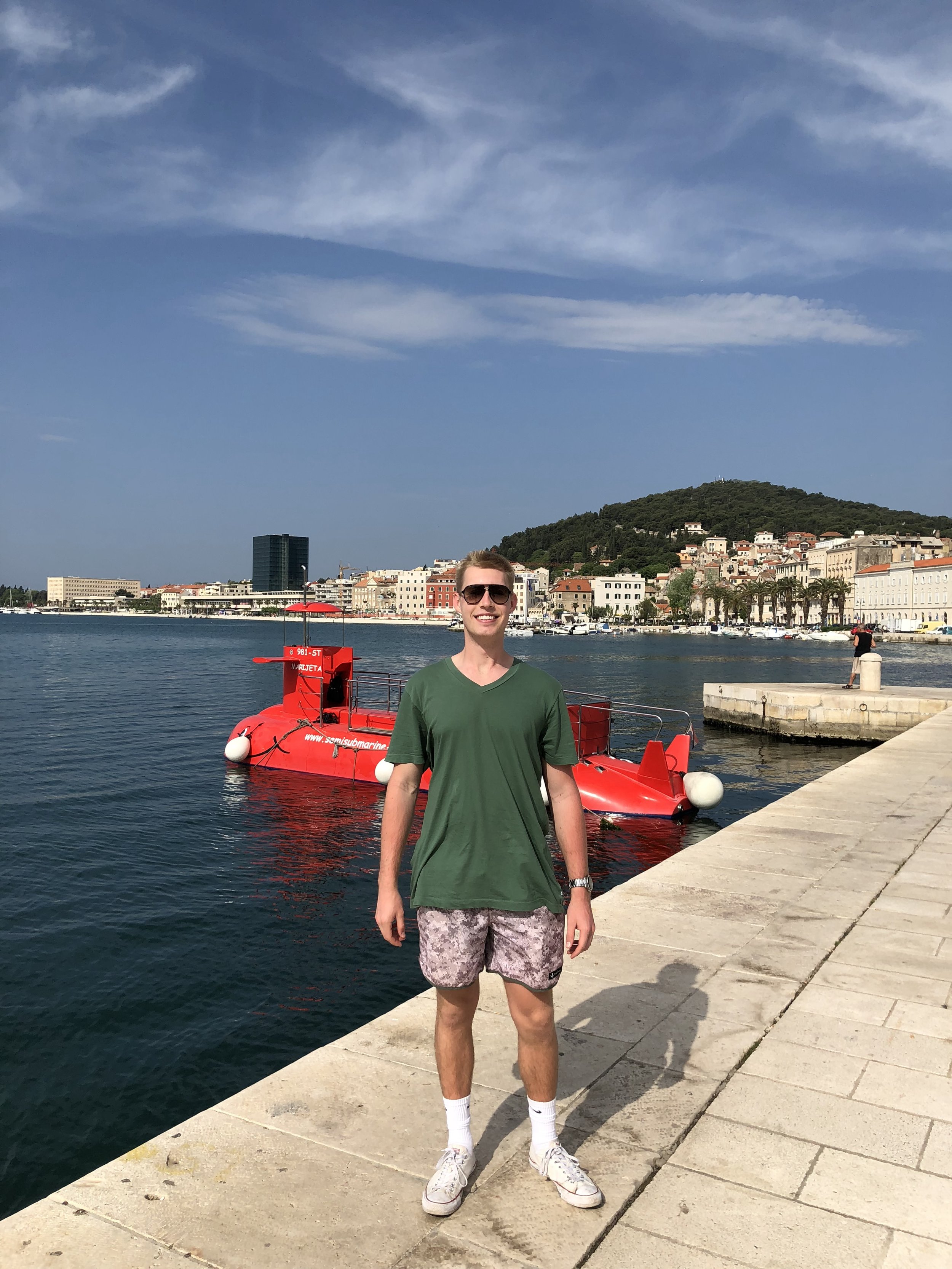 Photo of Adam in front of Riva in Split Croatia