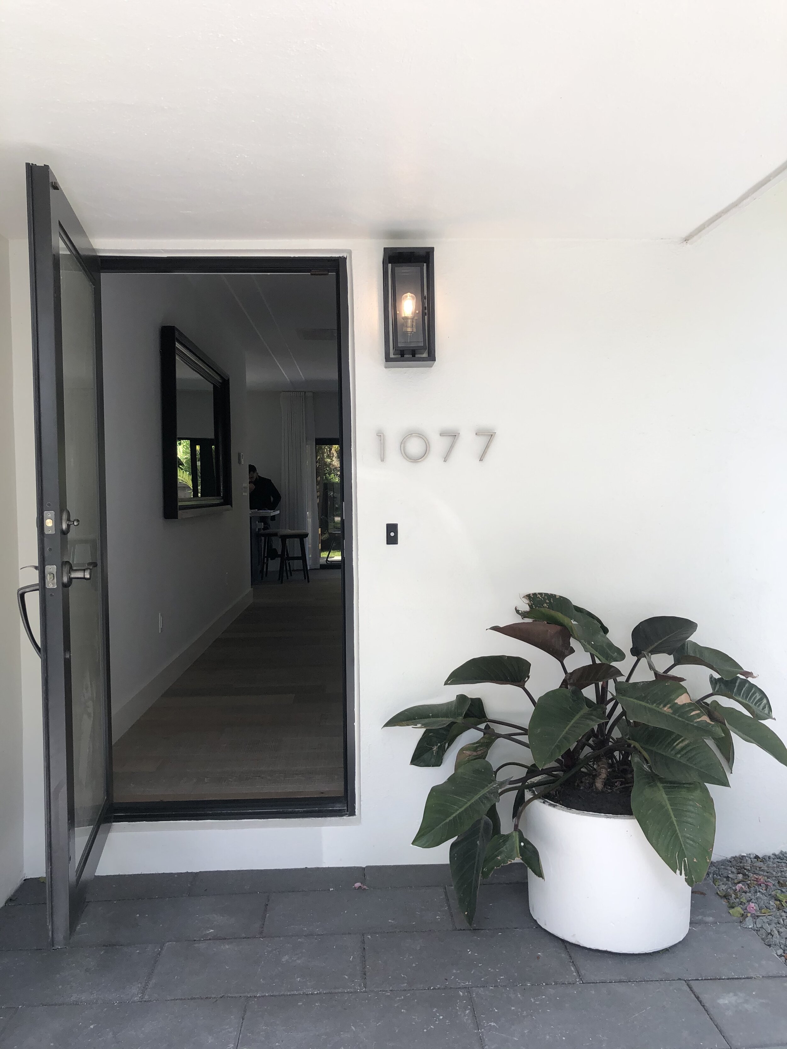 Entrance to a renovated pool home in Miami Shores