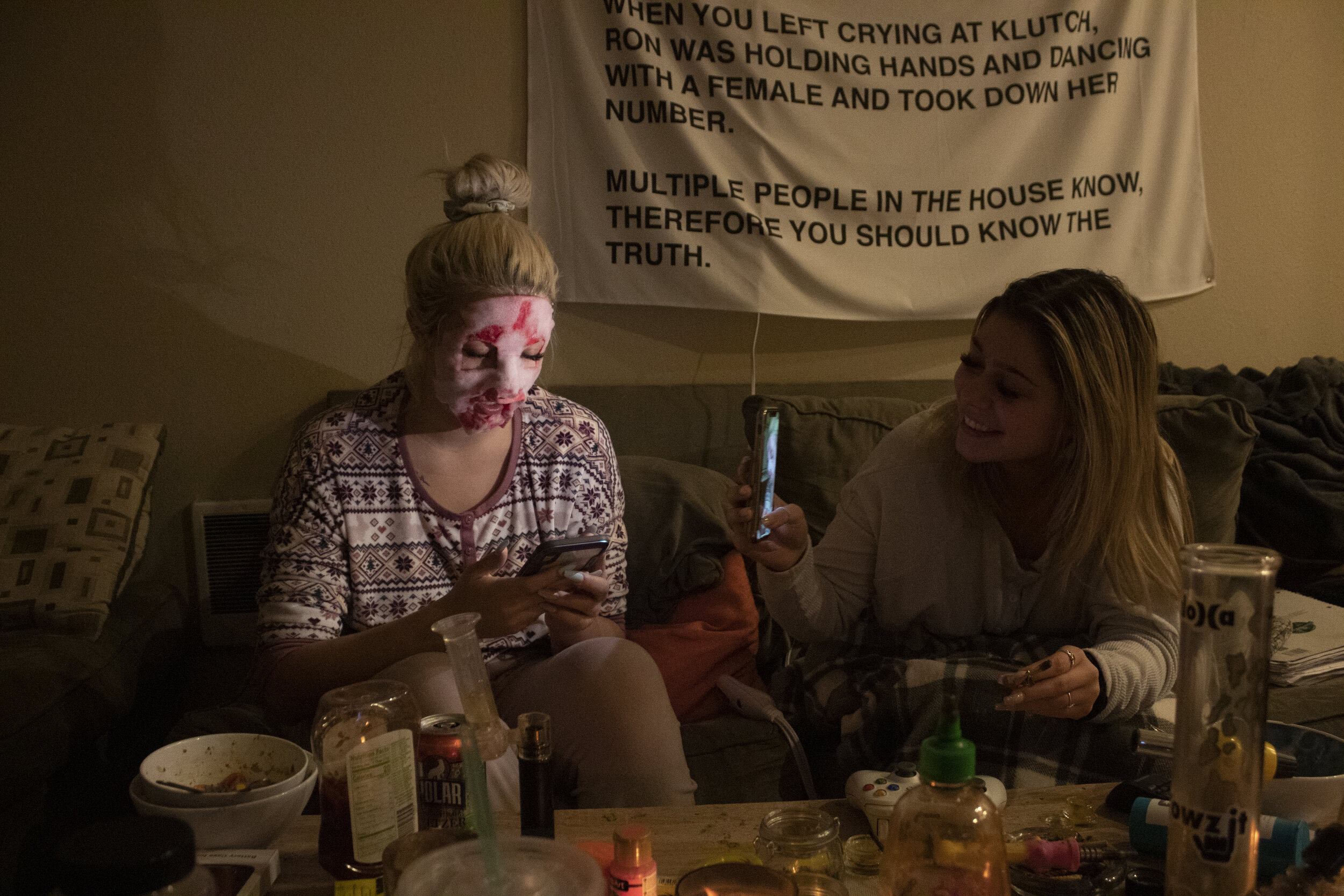 Kira, right, laughs while taking a picture of Naomi in a face-mask. Kira and Naomi have known each other since attending Lincoln High School in Portland, and plan to travel together after graduation.