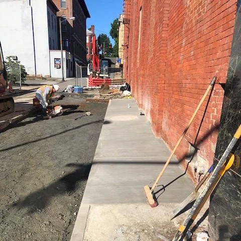 Pouring a new sidewalk on 11th St.