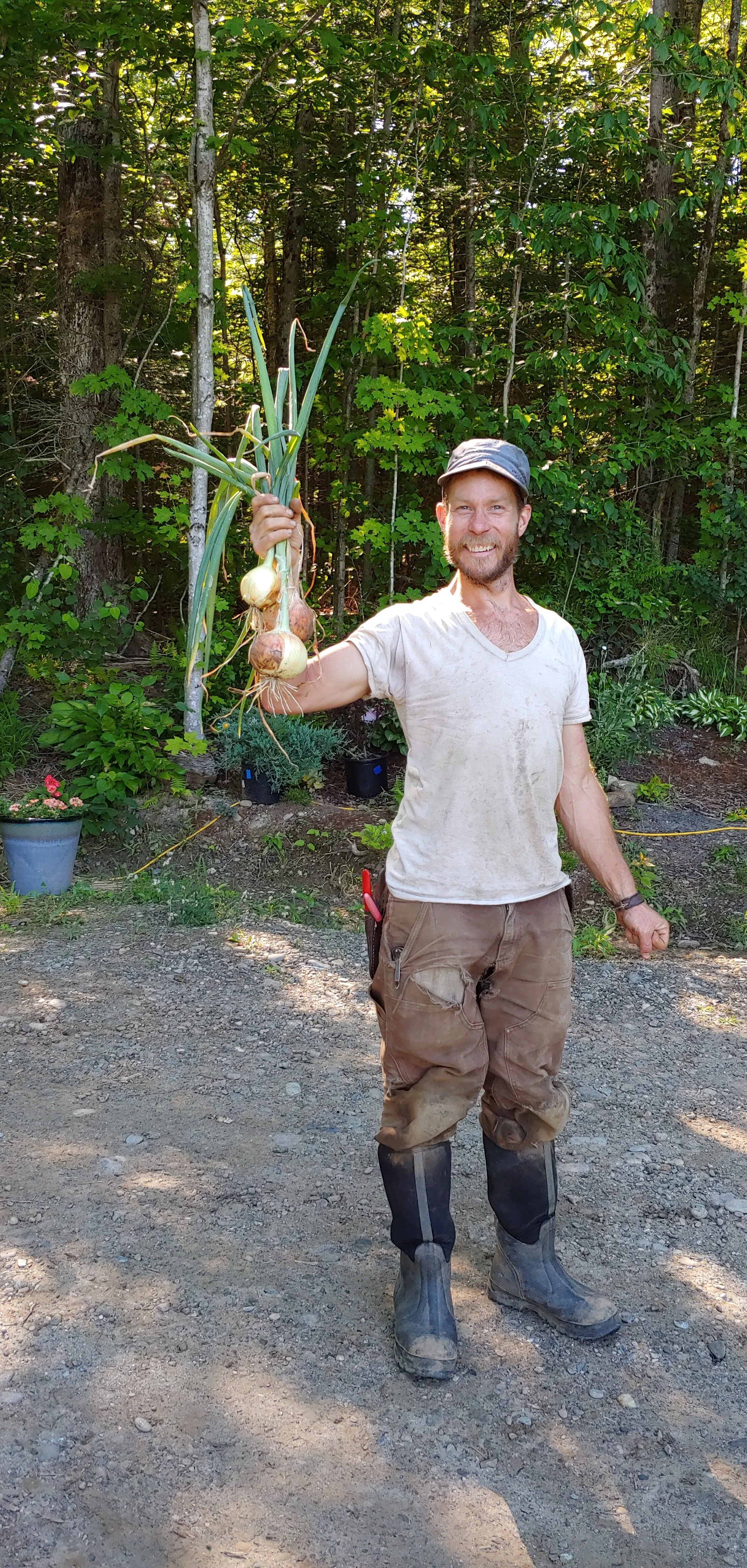 Proud grower with his onions.