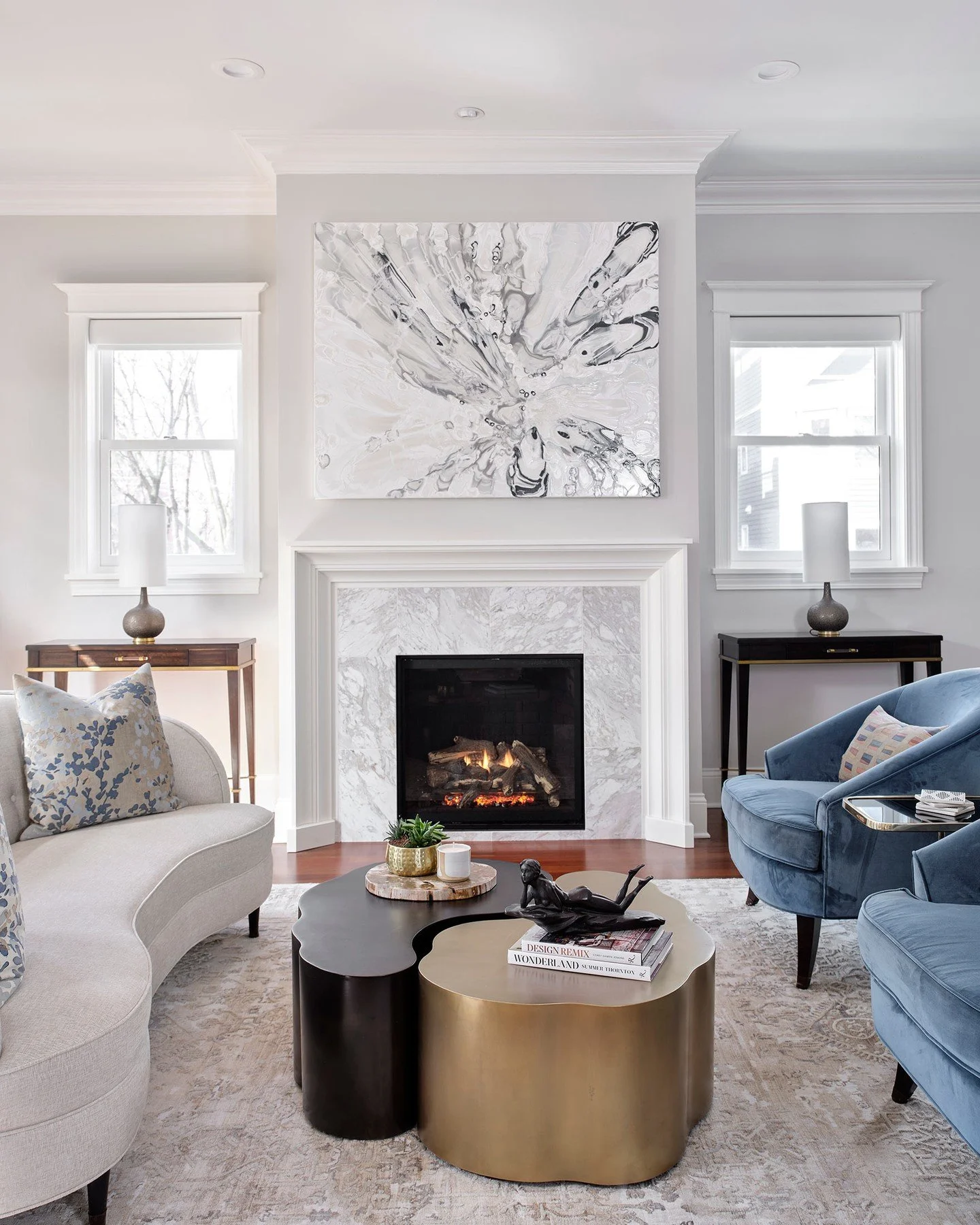 Light! Texture! Rhythm! A living room we designed to feel composed yet deeply inviting.⁠
.⁠
The marble fireplace anchors the room with a soft, steady presence. Curved silhouettes and layered textiles bring ease.⁠
Metallic accents catch the afternoon 