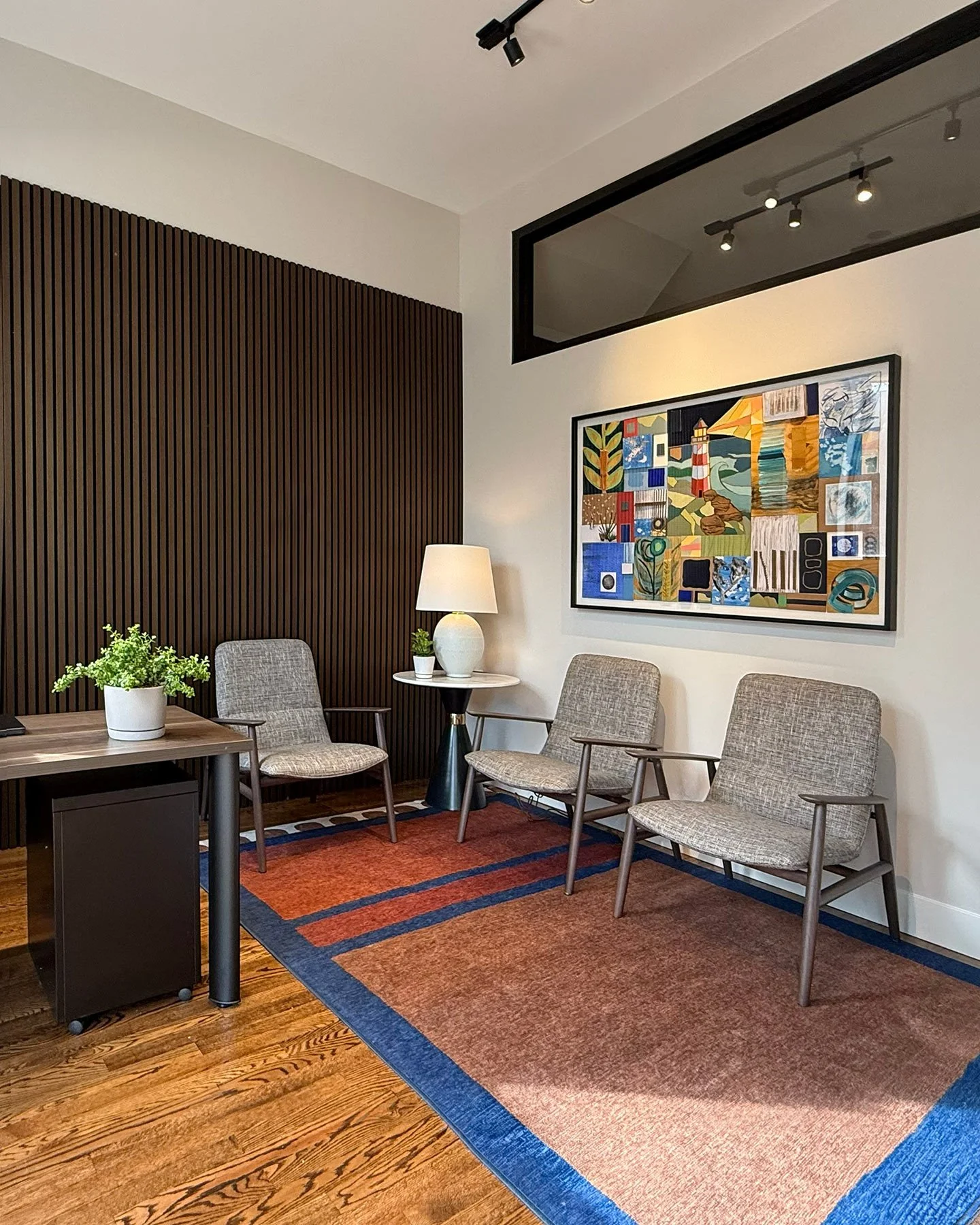 Epic Interiors is pleased to share the completion of AR Intervention, a private therapy practice designed with a rich, material-driven sensibility and a strong midcentury modern influence.⁠
⁠
Deep charcoal tones, layered wood elements, and a curated 