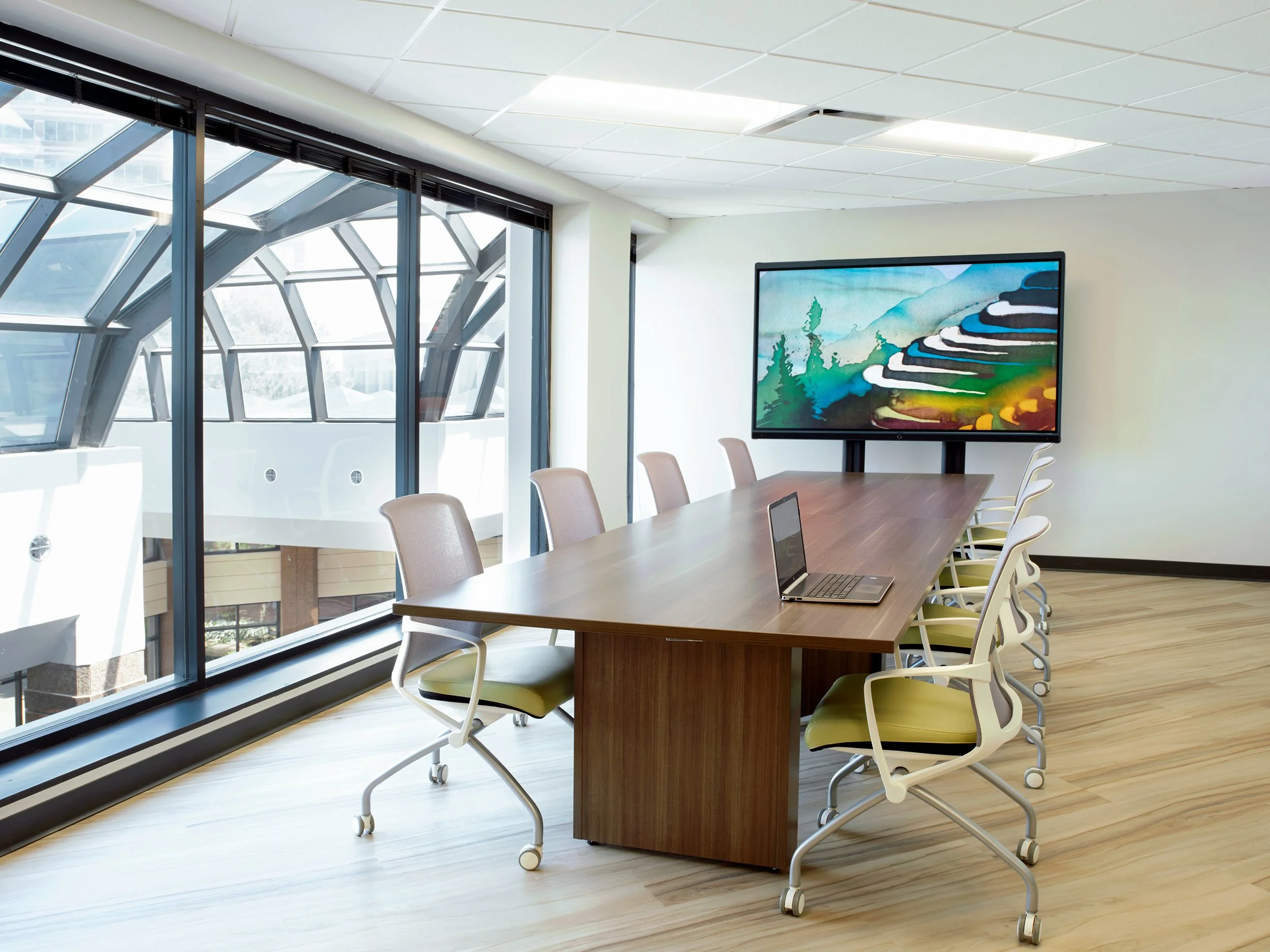 Boardroom at Skyway Behavioral Health featuring modern conference seating, wood finishes, and glass partitions, designed by Epic Interiors to encourage collaboration and professional connection across teams.