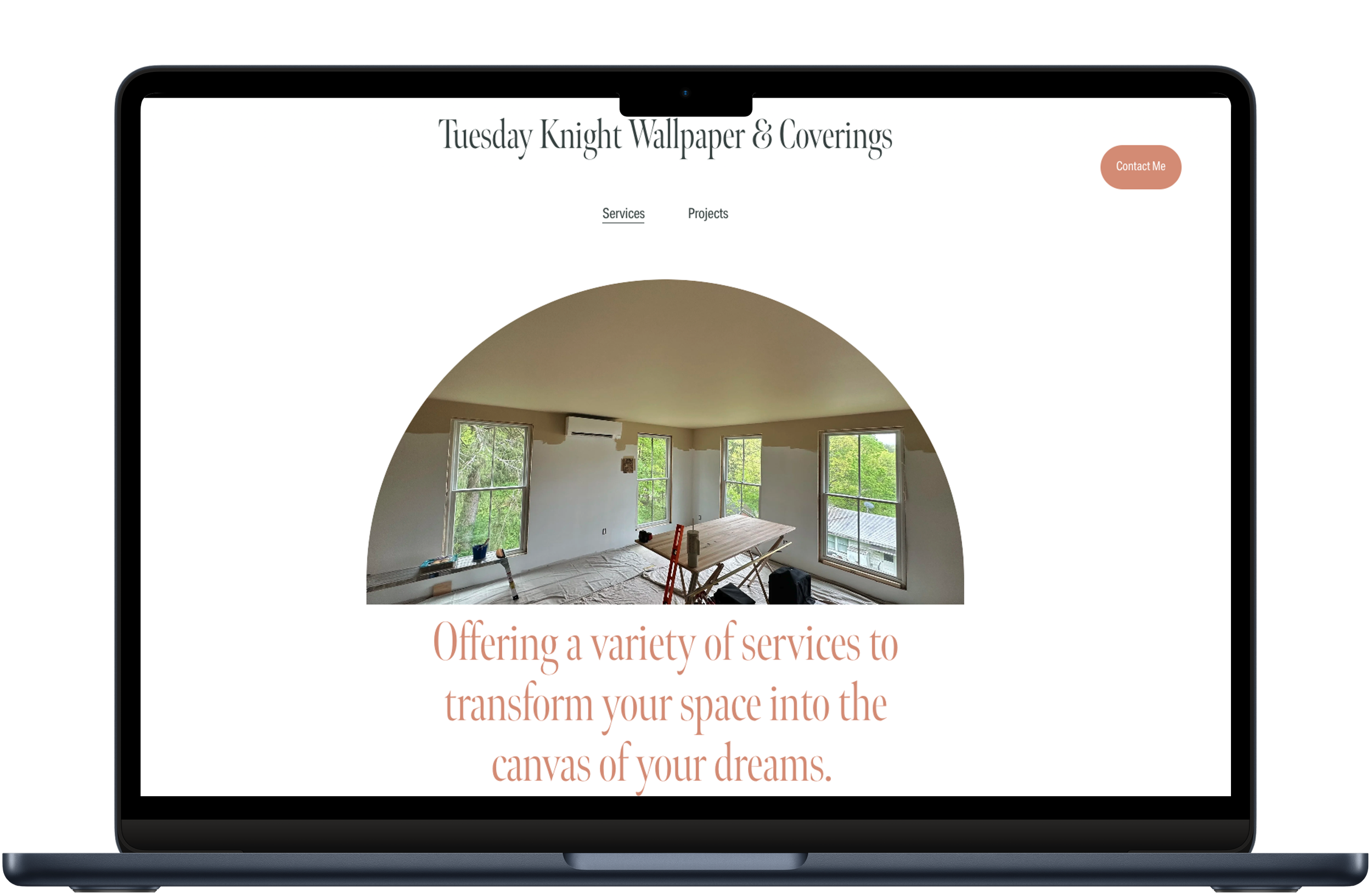 A laptop mockup of the Tuesday Knight Wallpaper & Coverings website, featuring a minimalist white layout and an arched photo of a room under renovation.