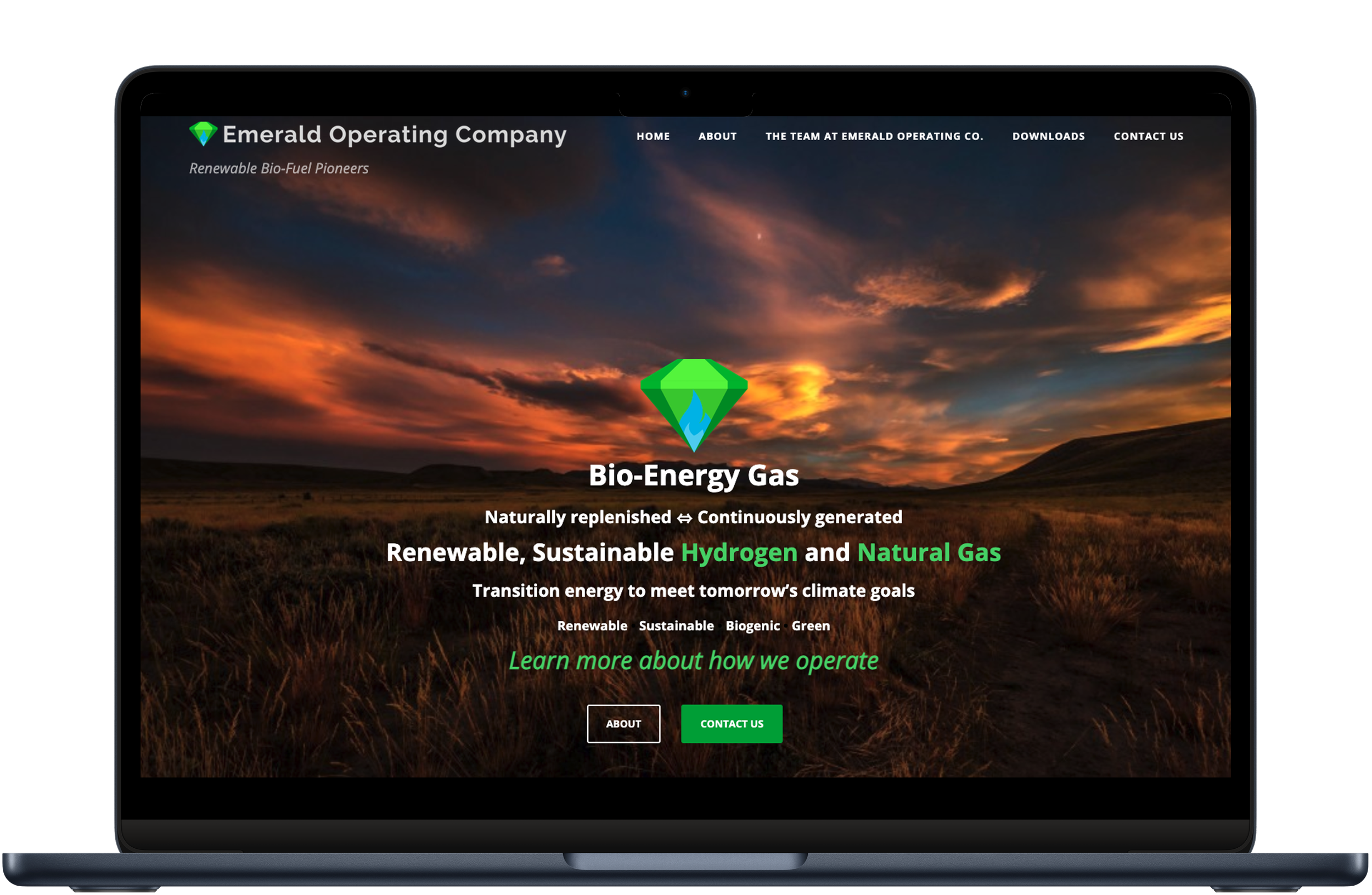 A laptop mockup showing the Emerald Operating Company homepage, featuring a sunset field background and text about renewable bio-energy gas.