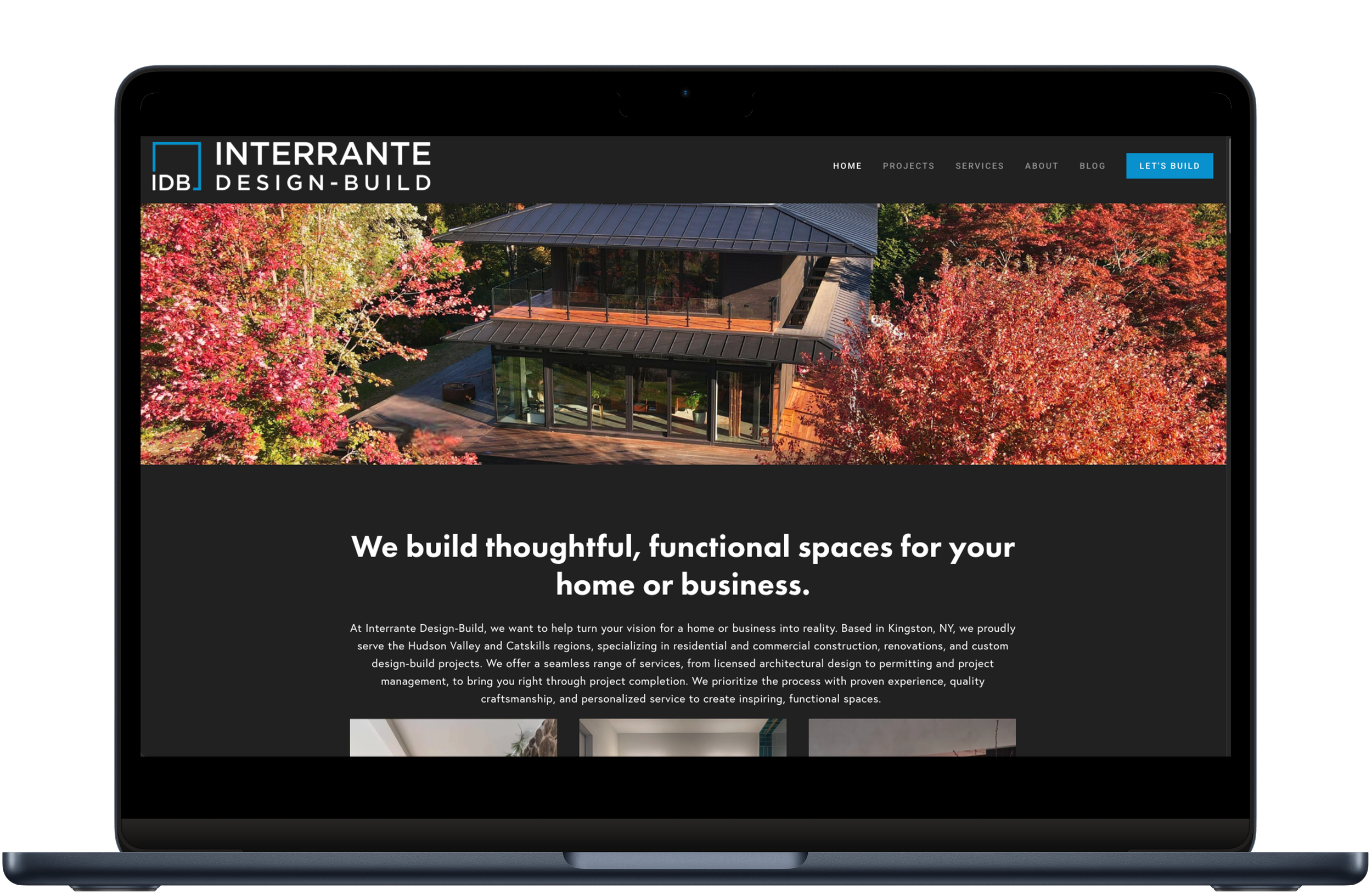 A laptop screen displaying the Interrante Design-Build homepage, featuring a modern house among autumn trees and the text "We build thoughtful, functional spaces."